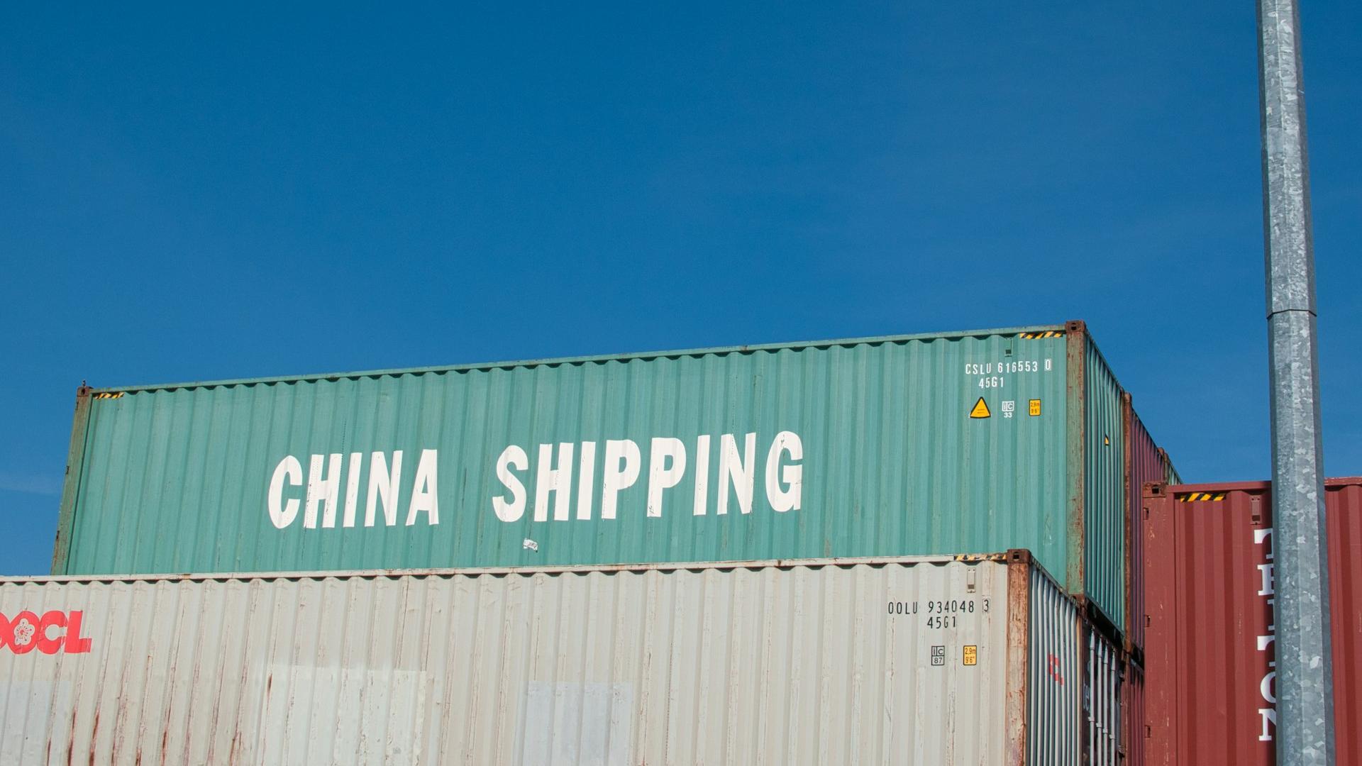 Shipping from China: EXW or FOB? a large container with a sign on it