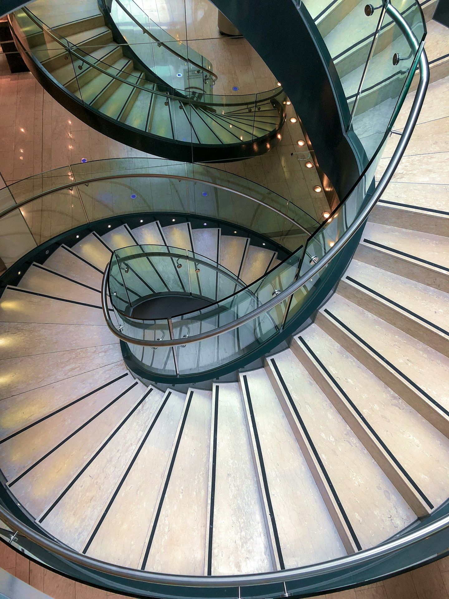 Spiral Staircase gray spiral staircase with brown wooden railings