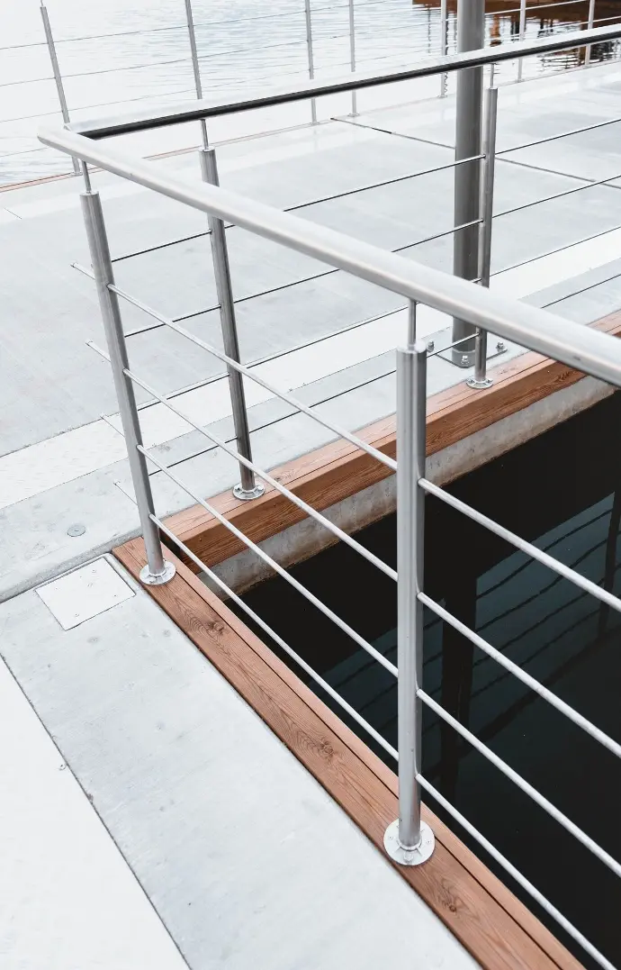 A metal railing on a dock A metal railing