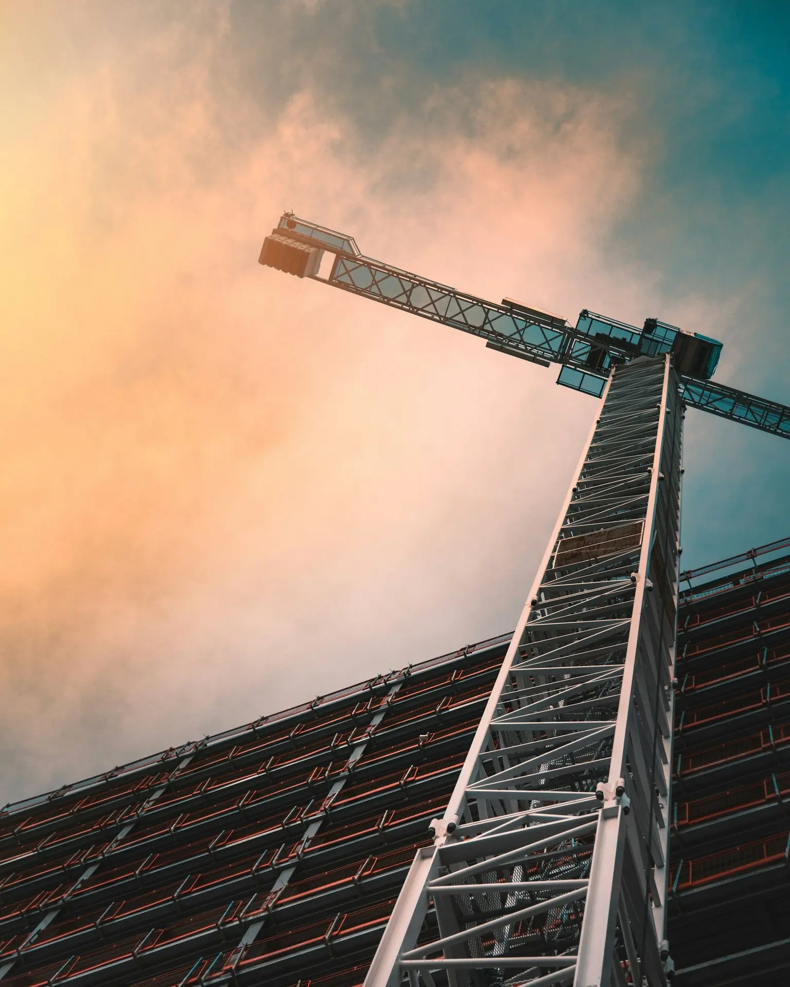 Building Materials from China low angle photography of gray tower crane