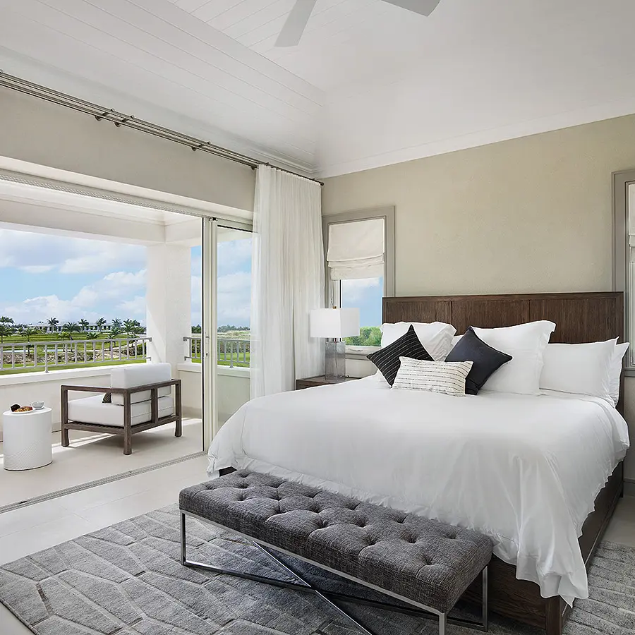  Oceanfront bedroom with spacious bed and stunning view.