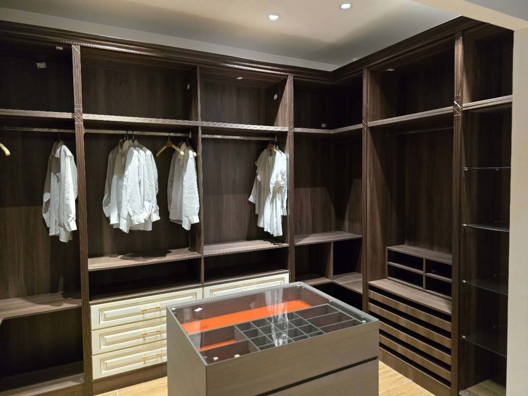 A walk-in closet with detailed millwork, A walk-in closet with detailed millwork