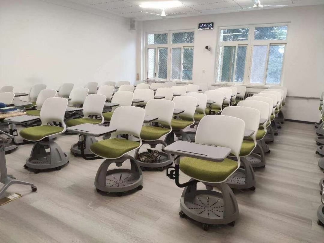 Classroom featuring modern rolling chairs with desks in a bright, organized space.
