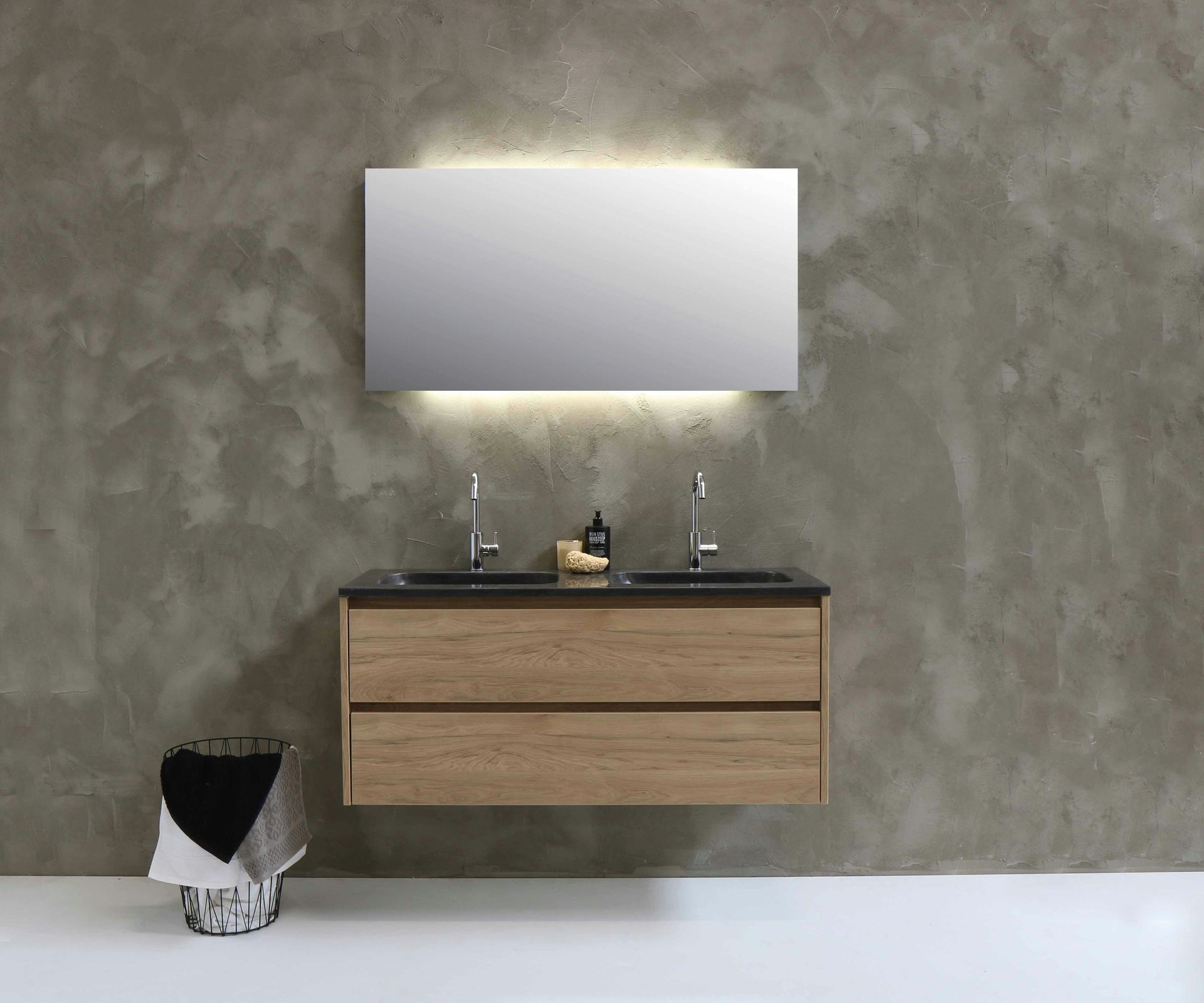 Stylish modern vanity unit with a sleek sink, elegant mirror, and organized storage compartments in a contemporary bathroom setting.