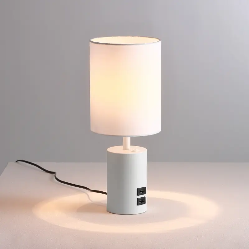Modern decorative lamp with a white shade and USB ports.
