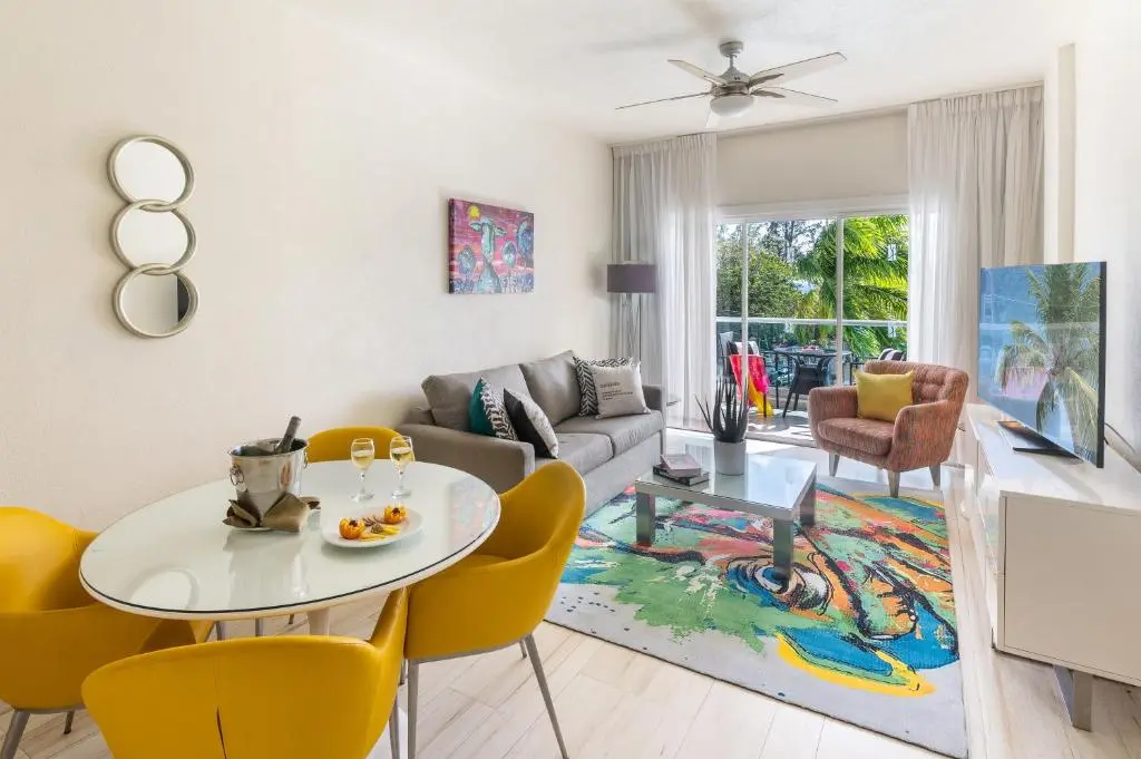 Stylish living area at The Rockley, featuring a modern design with colorful decor, comfortable seating