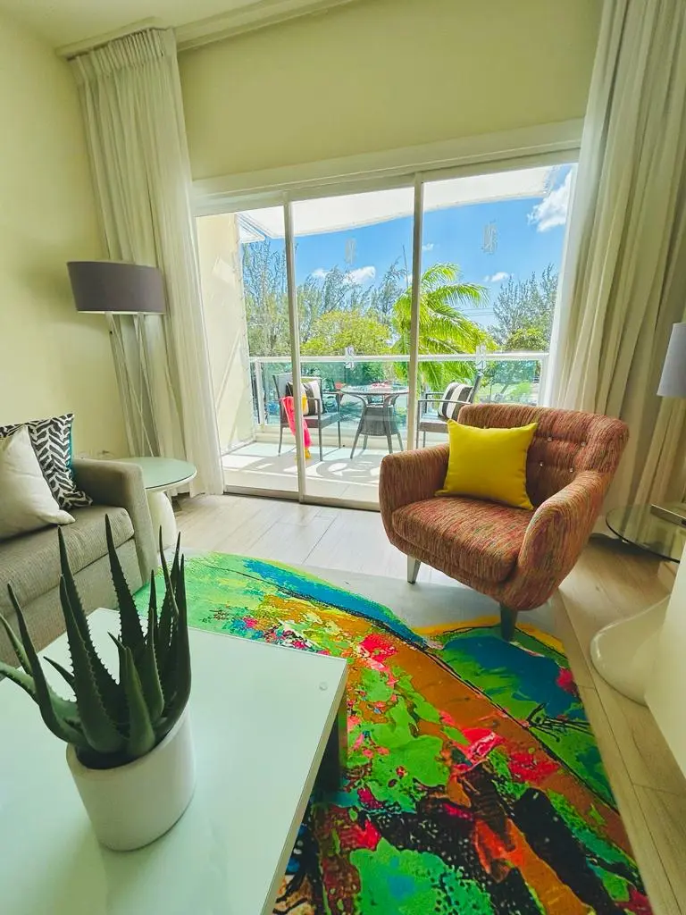 Bright living area at The Rockley with vibrant decor, comfortable seating