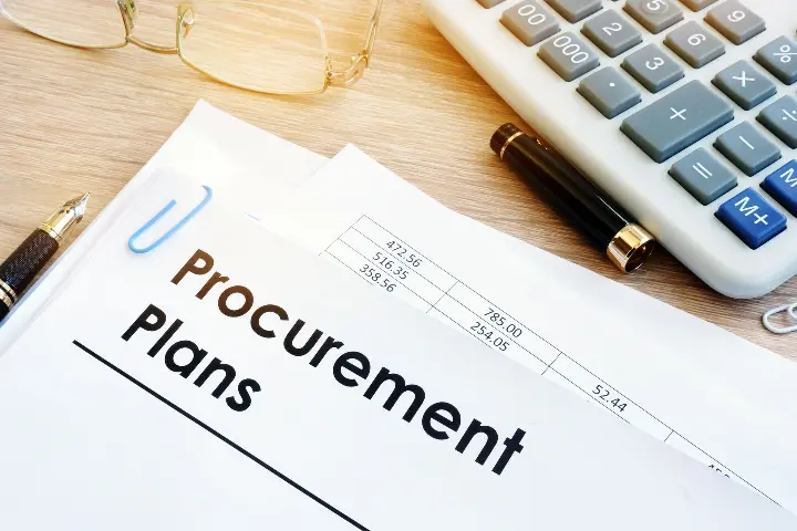 A paper on a desk with the heading "Procurement Plans"