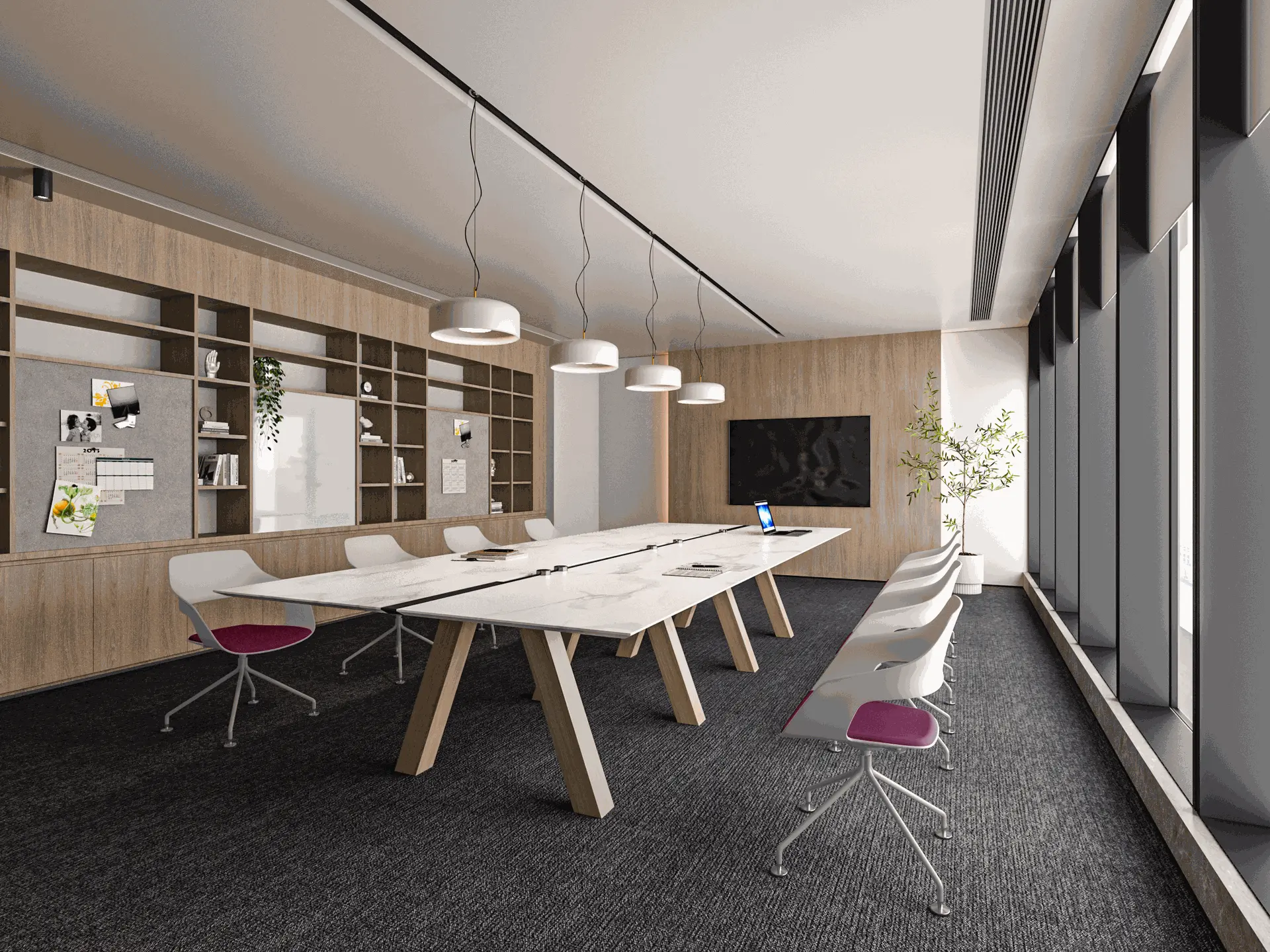 Modern conference room with a long table, white chairs, pendant lights, large windows, wall shelves, and a flat-screen monitor. Natural light fills the space.