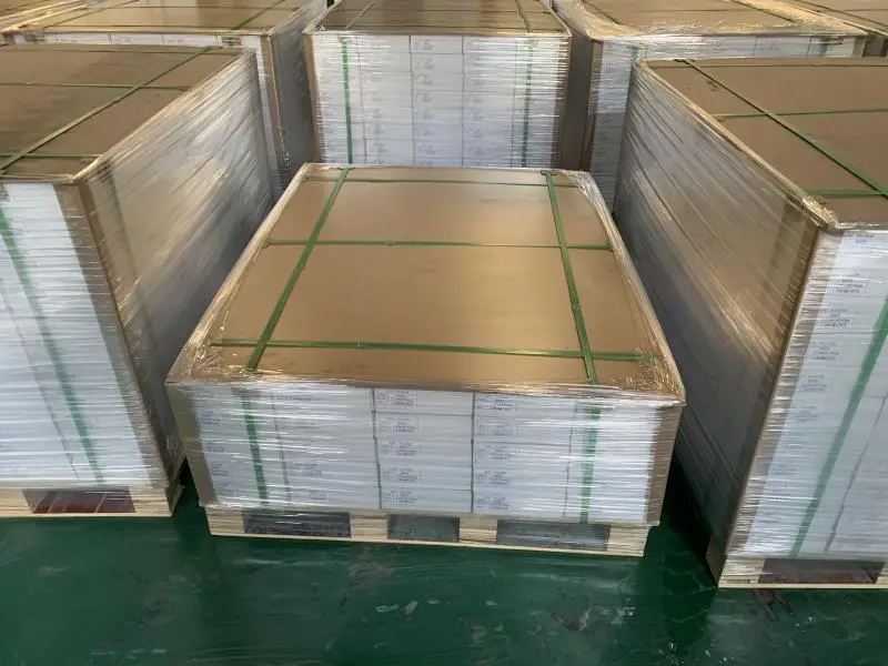 SPC flooring pallets with interlocking planks and protective wrap in warehouse setting Pallet of SPC flooring planks wrapped in plastic, stacked on a wooden pallet in a warehouse