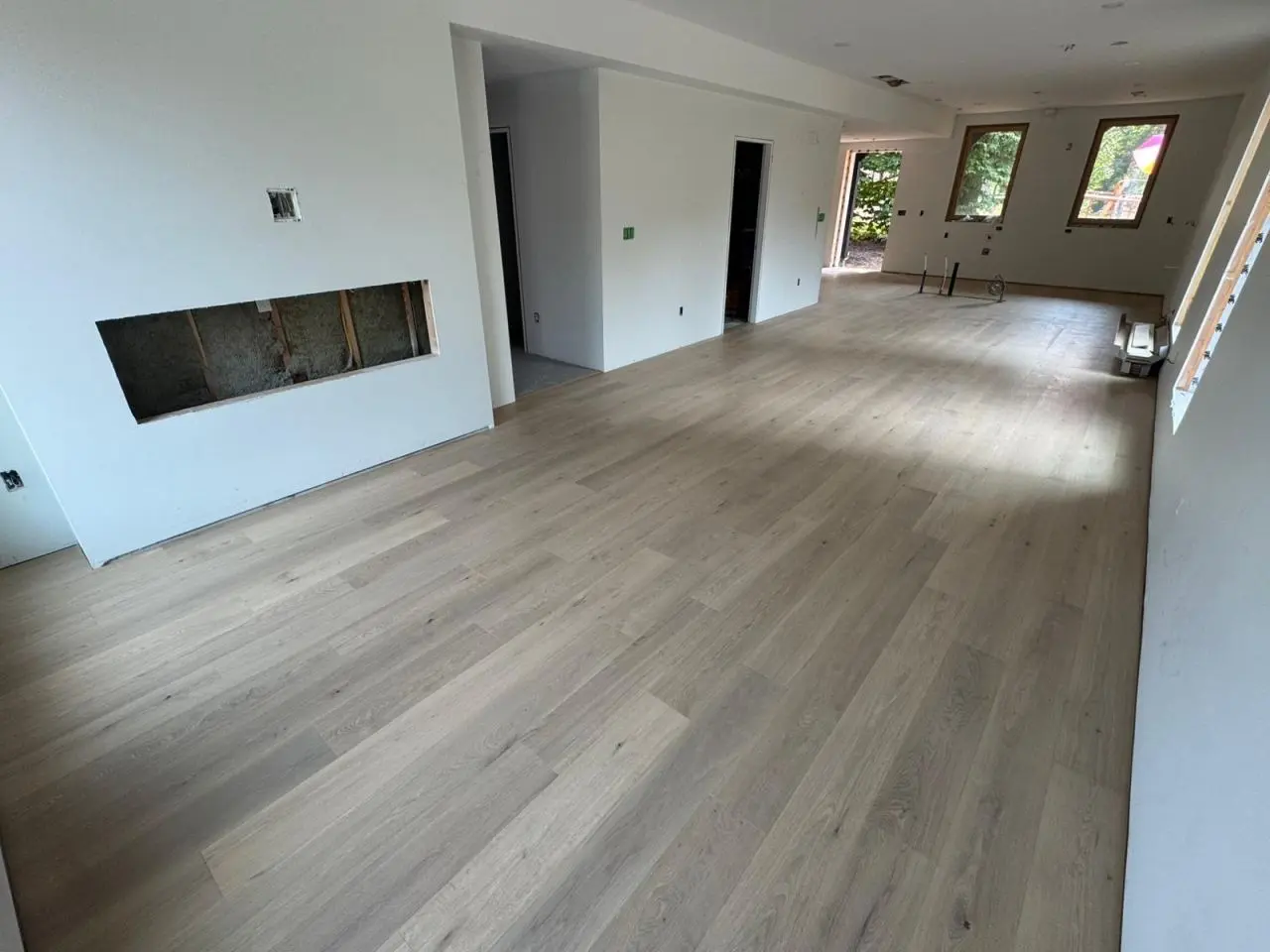 Living area with new timber flooring under construction