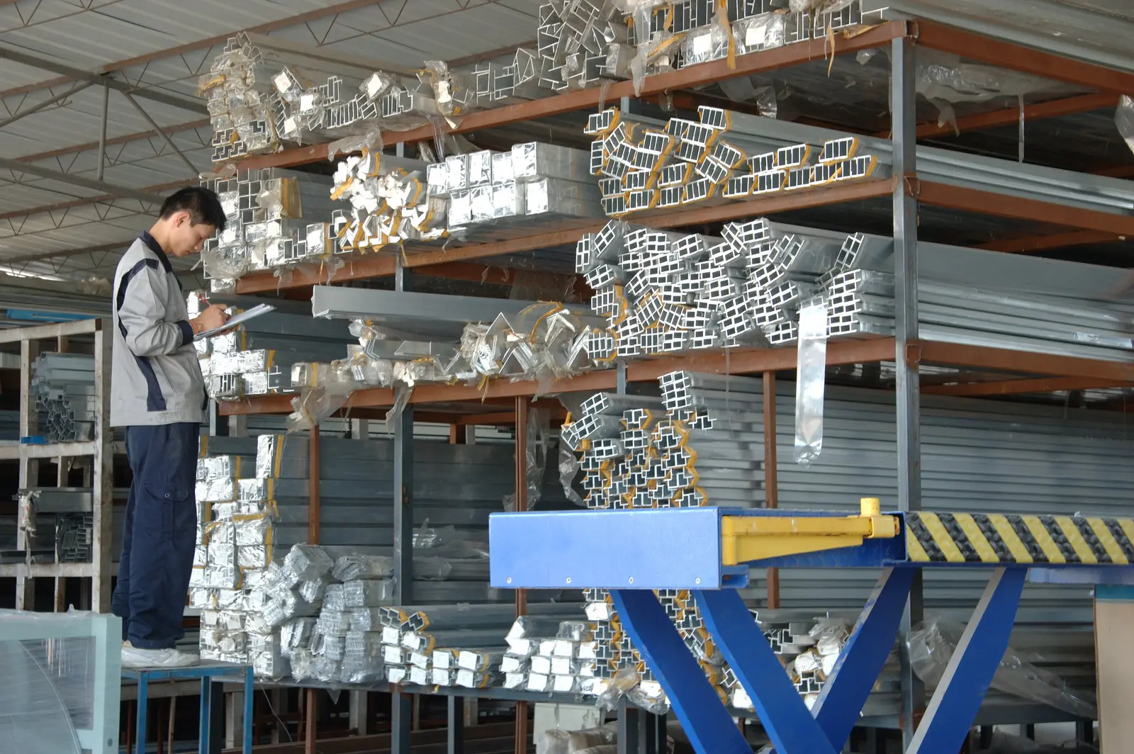 China Building Materials: From Raw Materials to Finished Products A person checking building materials in Guangzhou