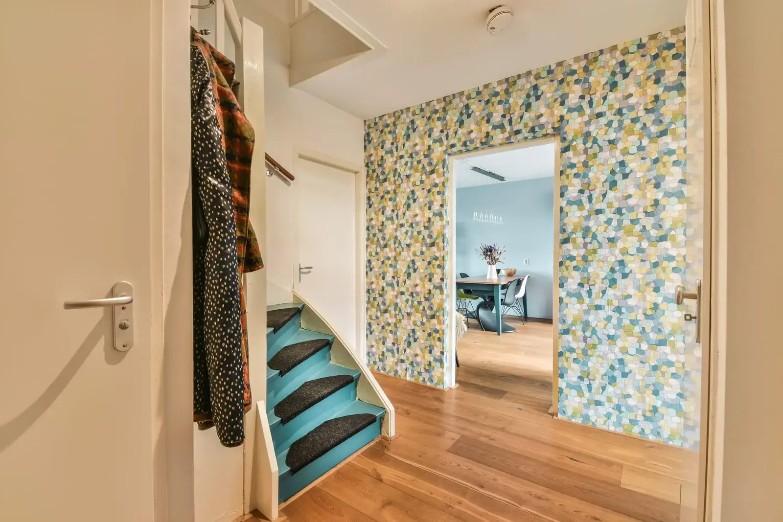 Colorful patterned wallpaper in a modern hallway showcasing China-made wall finishes that combine texture, durability, and easy installation for stylish interiors.
