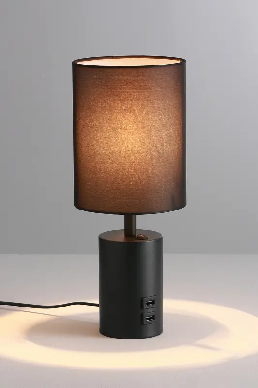 A sleek black table lamp A modern black table lamp