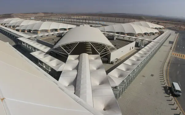 Aerial view of large tensile fabric shade canopies with white fabric stretched over steel supports at a modern outdoor complex, China