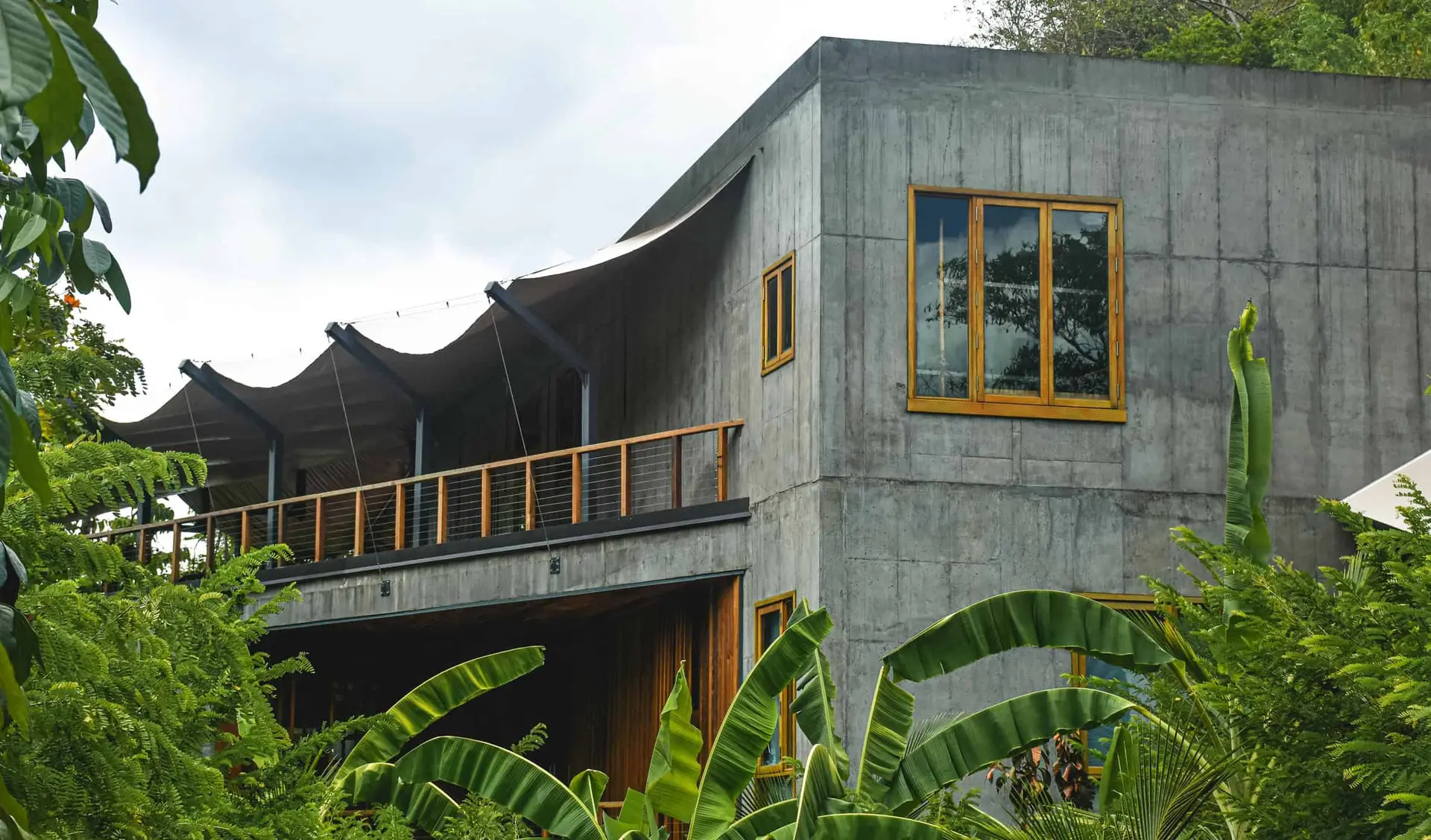 Exterior view of the Secret Bay Art Barn in Dominica, showcasing its modern architecture