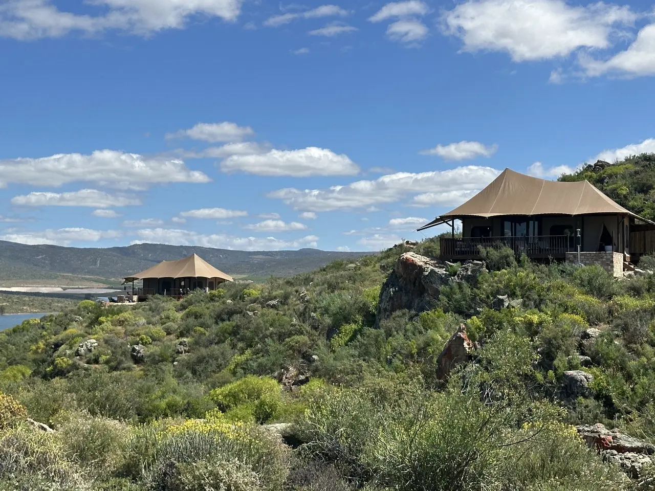 GZS sourced hillside Yamu tent lodge with canvas canopy and panoramic landscape views.