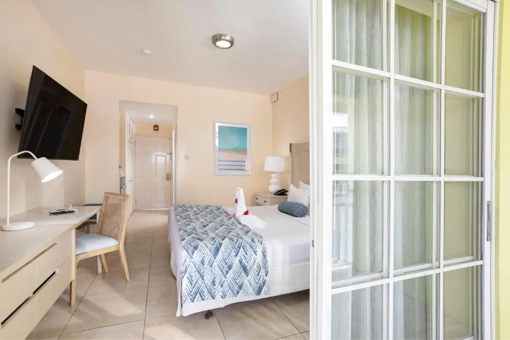 Bay Garden Hotel Guest Room Upgrade – GZS Sourced Materials Updated Bay Garden Hotel guest room with GZS sourced furniture, lighting, artwork, and SPC flooring.