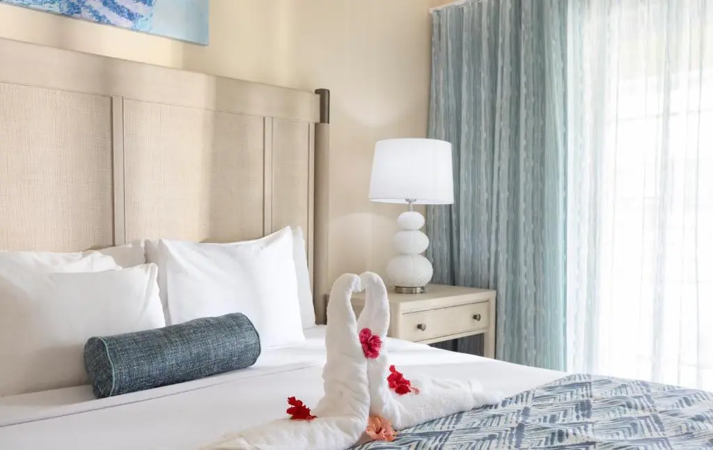 Bay Garden Hotel Guest Room Refurbishment – GZS Sourced Furniture & Drapery Bay Garden Hotel refurbished guest room featuring GZS sourced loose furniture, drapery, lighting, and modern bedding.