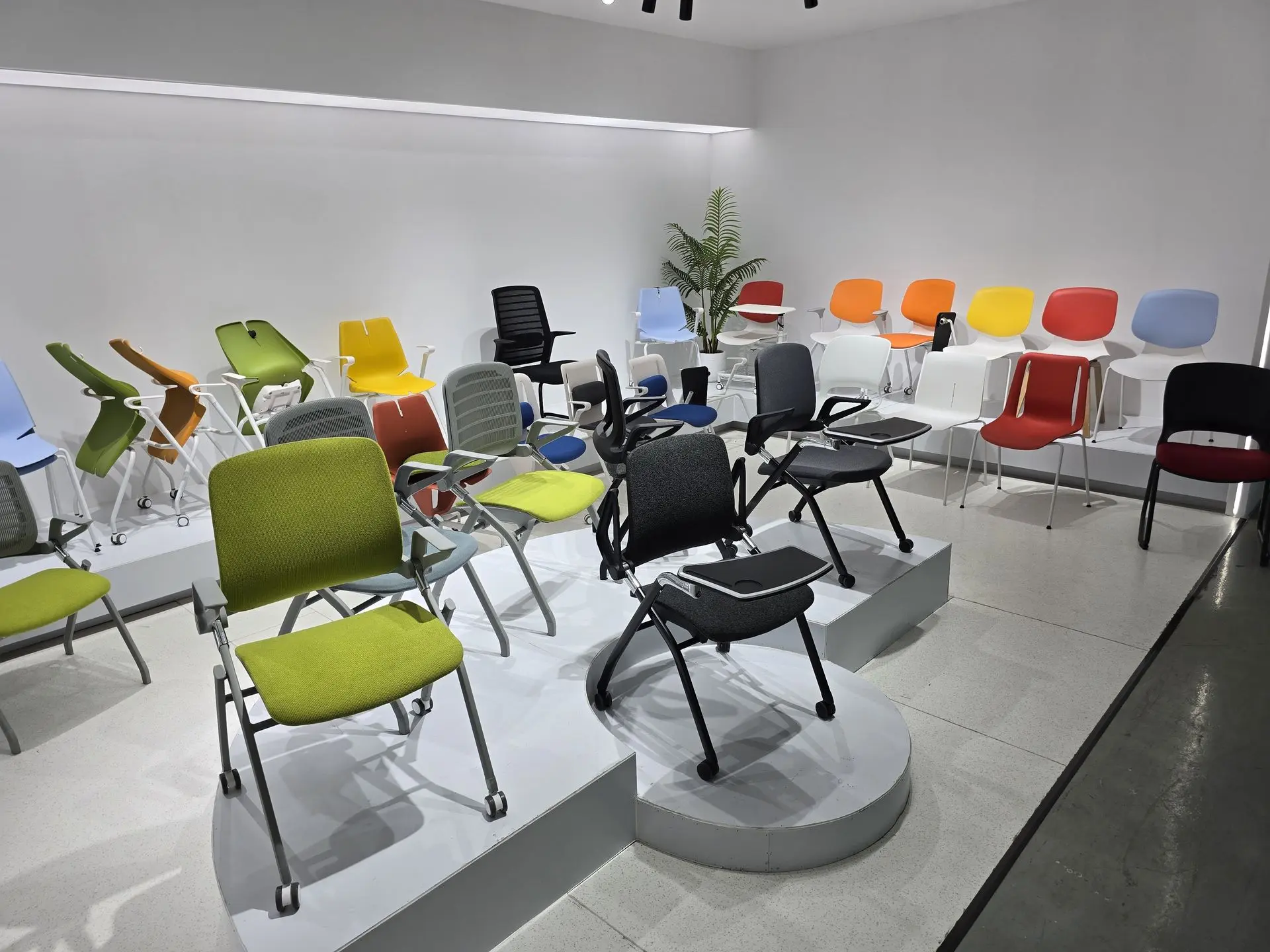 Display of modern office chairs in various colors and styles sourced from China.