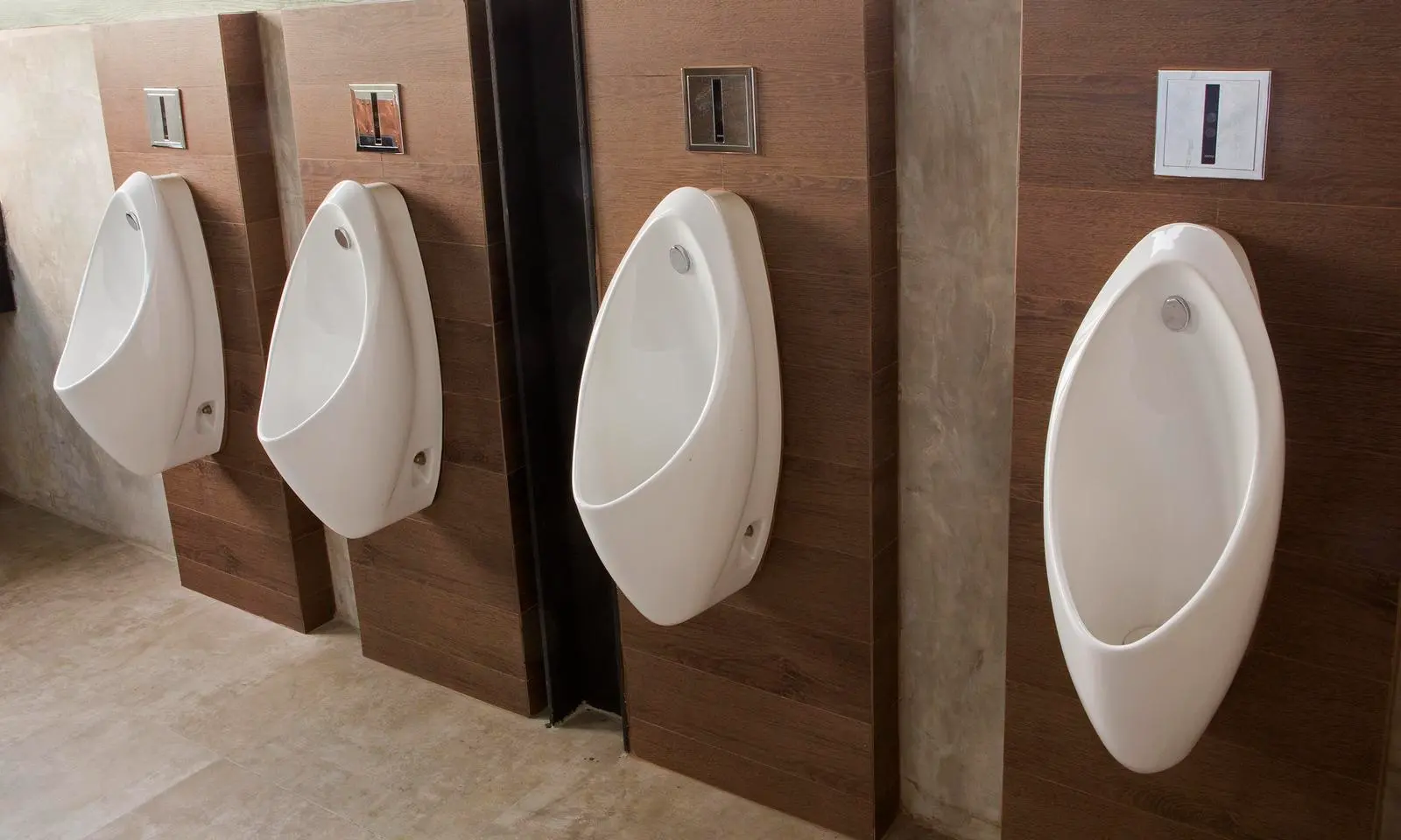 Public sanitary ware in China featuring modern wall-mounted urinals in a commercial restroom setting.