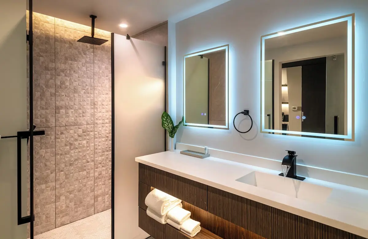 Modern hotel bathroom interior with LED mirrors and sanitary ware in China
