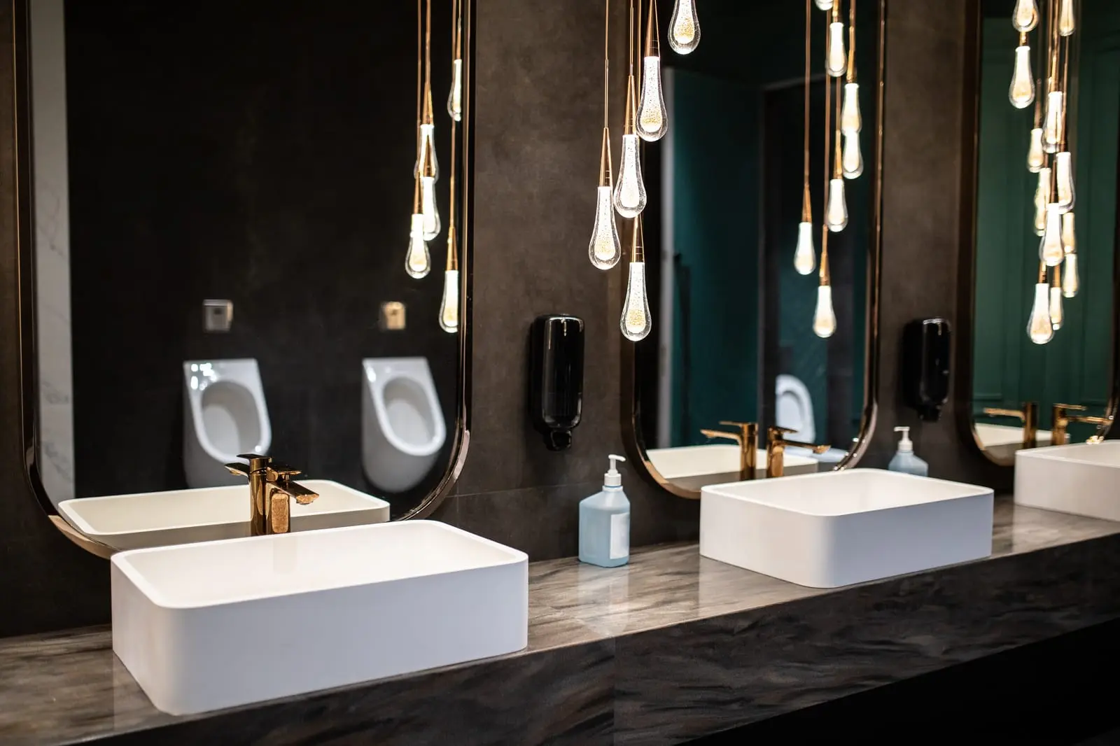 Modern commercial restroom with stylish sinks, mirrors, and urinals showcasing public sanitary ware in China.