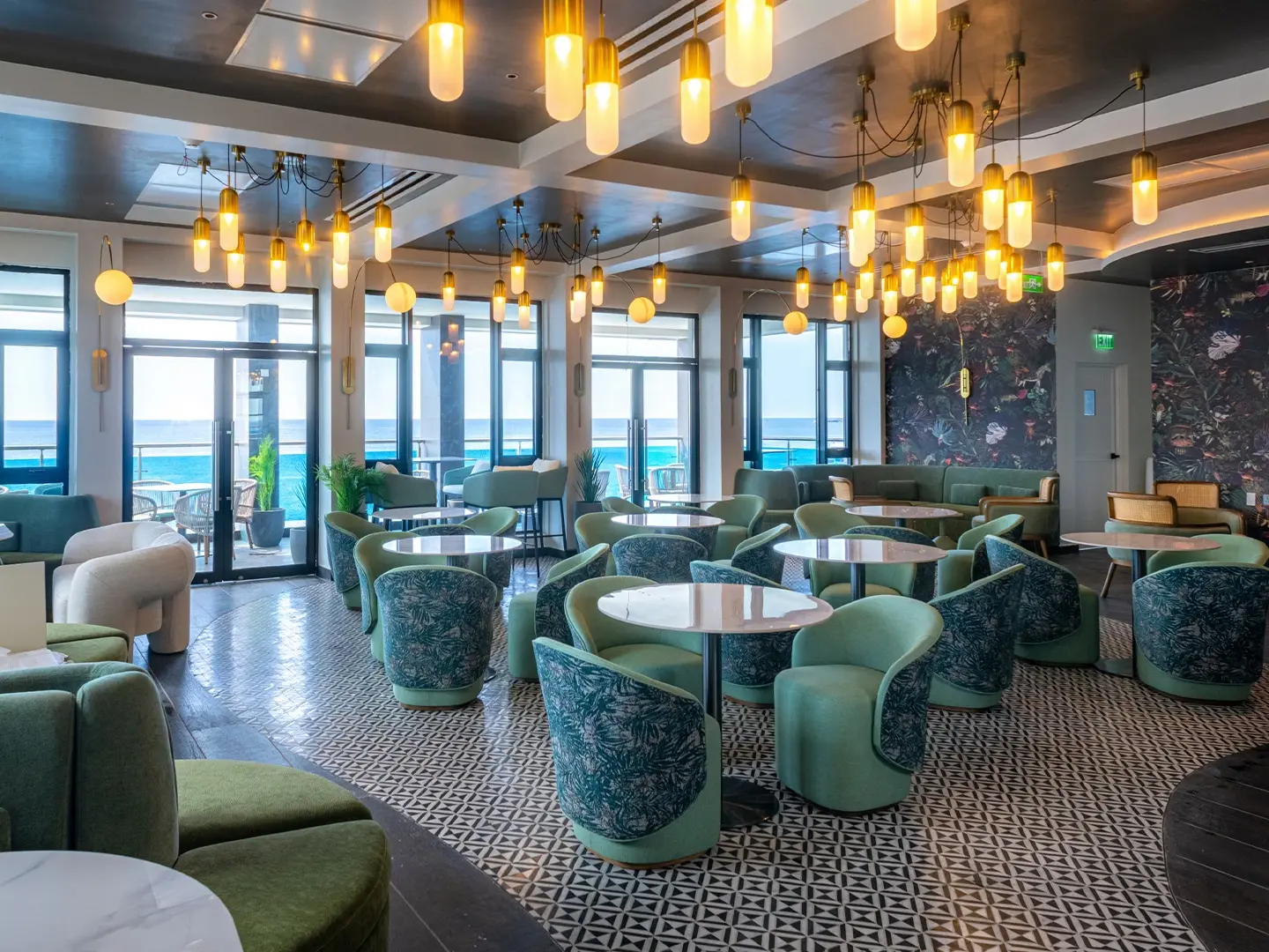 Modern hotel lounge with custom lighting fixtures installed, showcasing completed interior project.