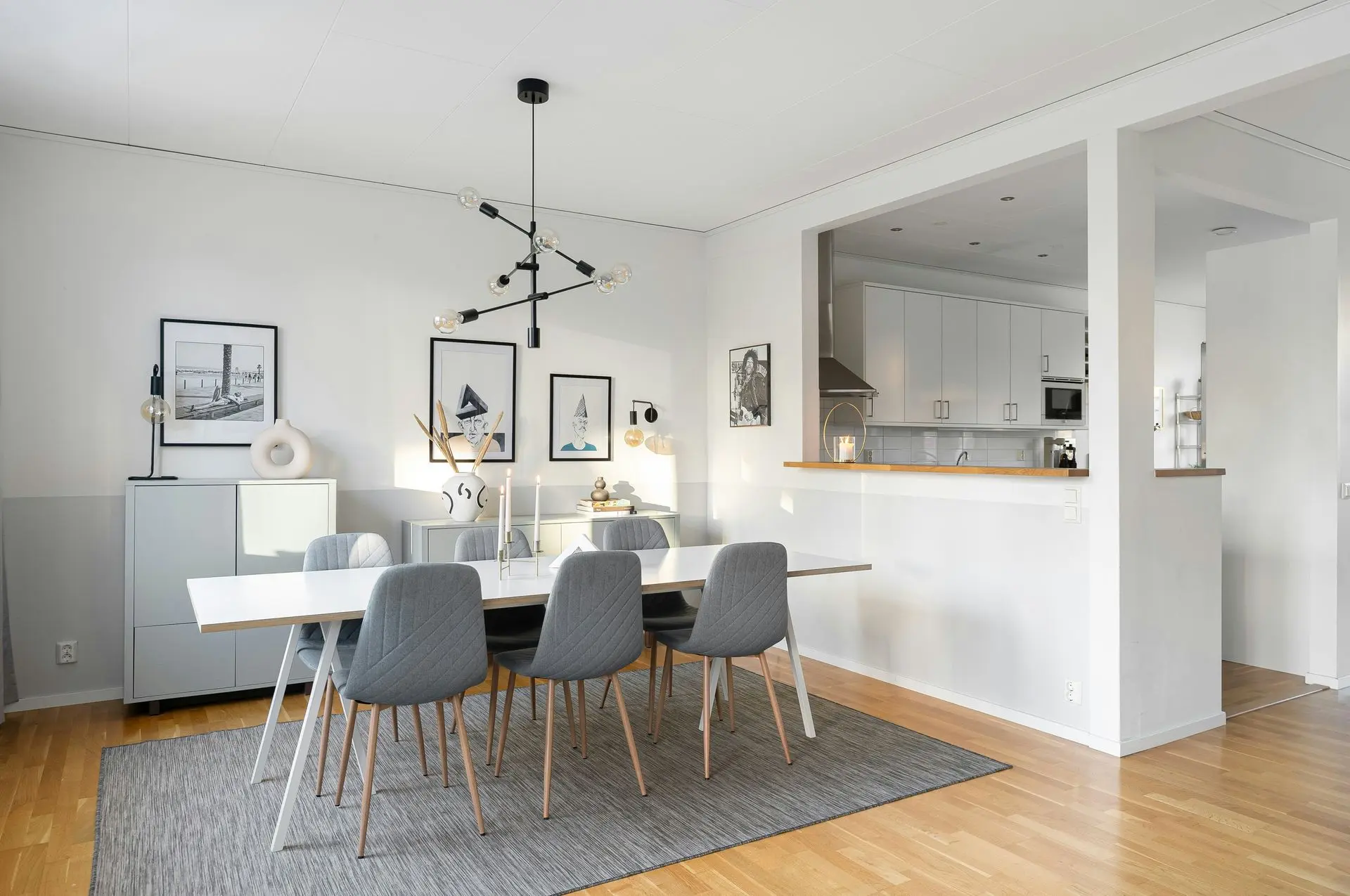 Custom Kitchen and Dining Interior – Whole House Customization Design Modern open-plan kitchen and dining area featuring custom cabinetry, minimalist design, and coordinated home interiors.