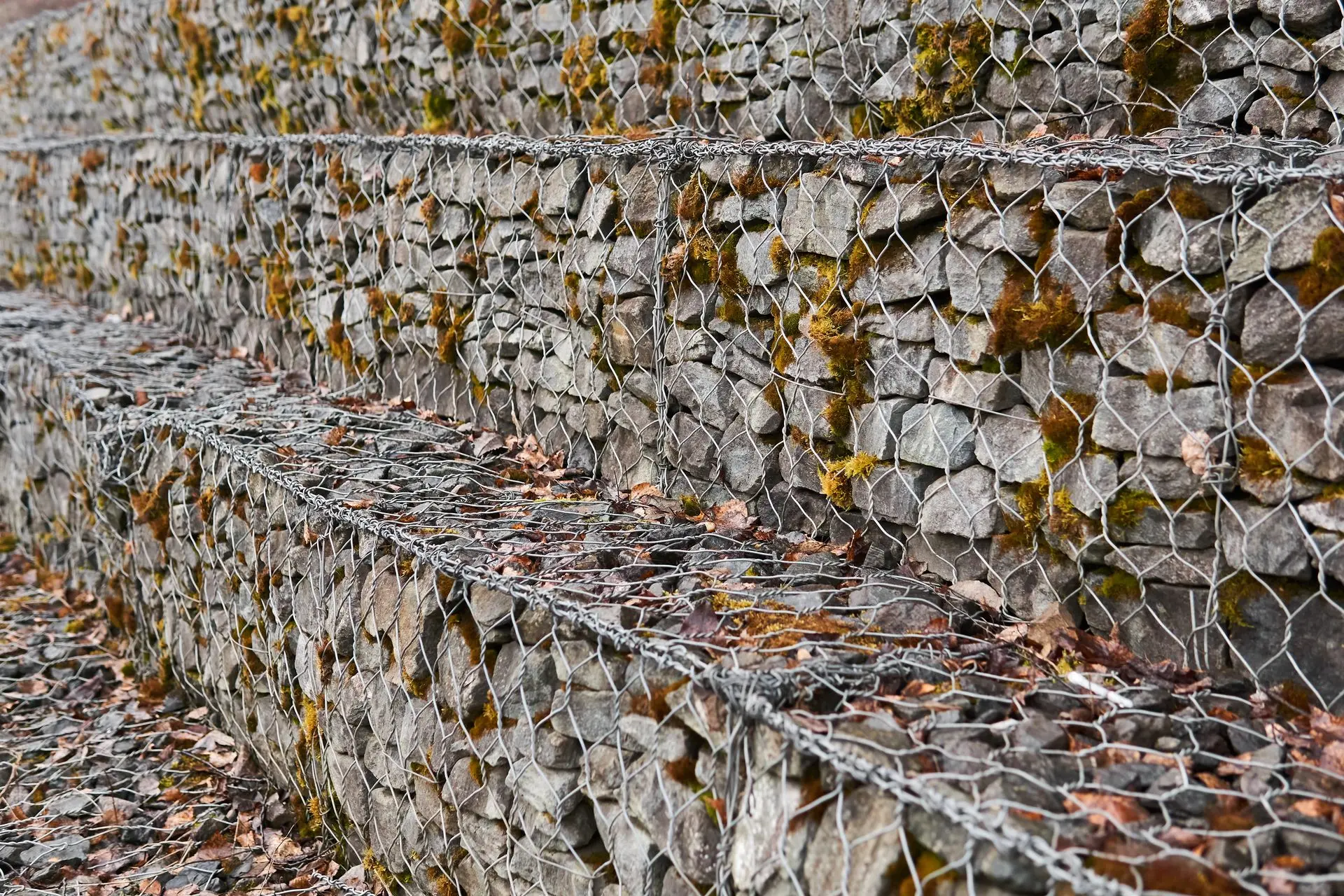 China gabion mattress installed as stepped retaining wall with wire mesh and stone fill