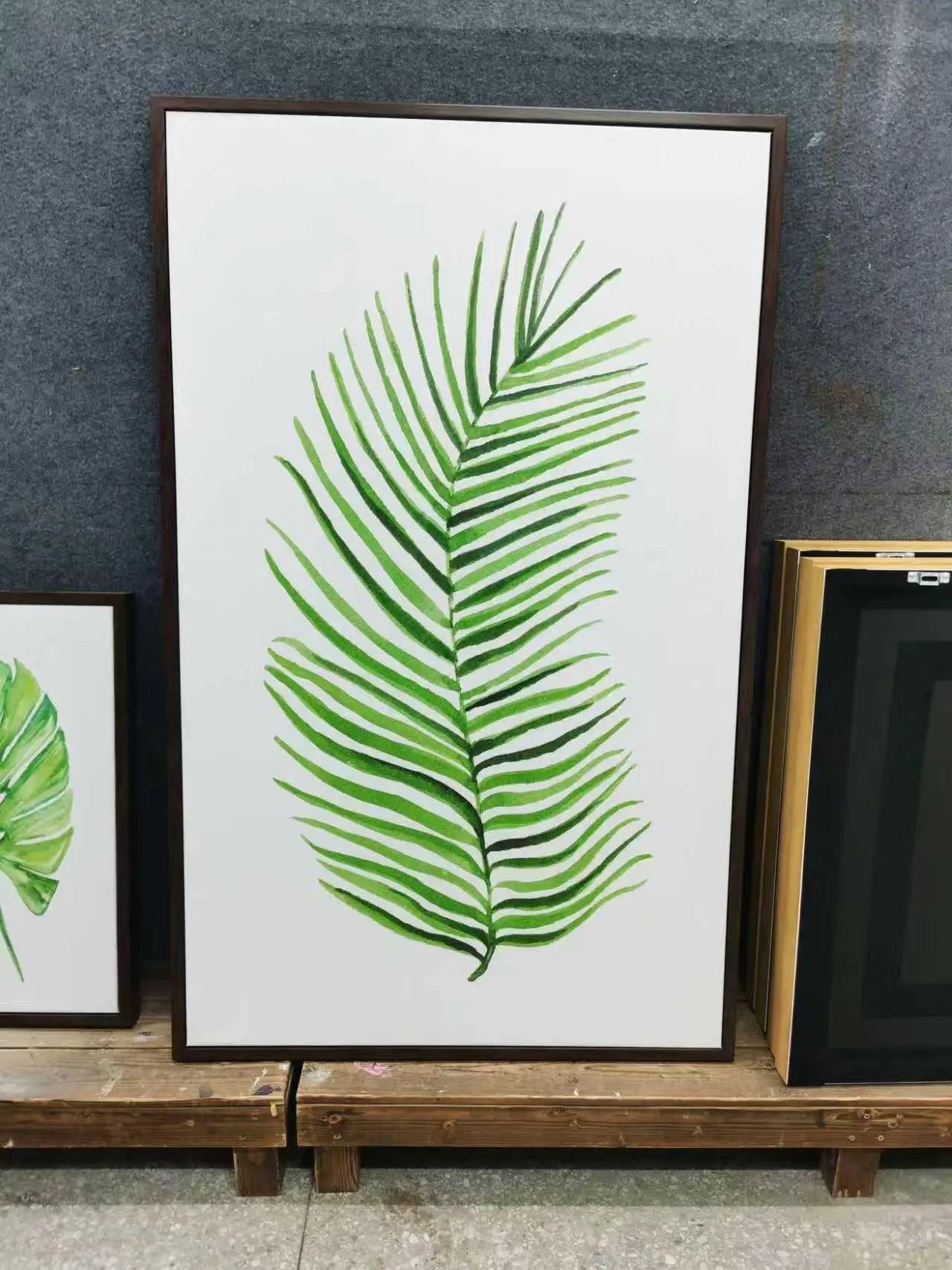Minimalist palm frond artwork in green, framed and GZS sourced for resort interiors.