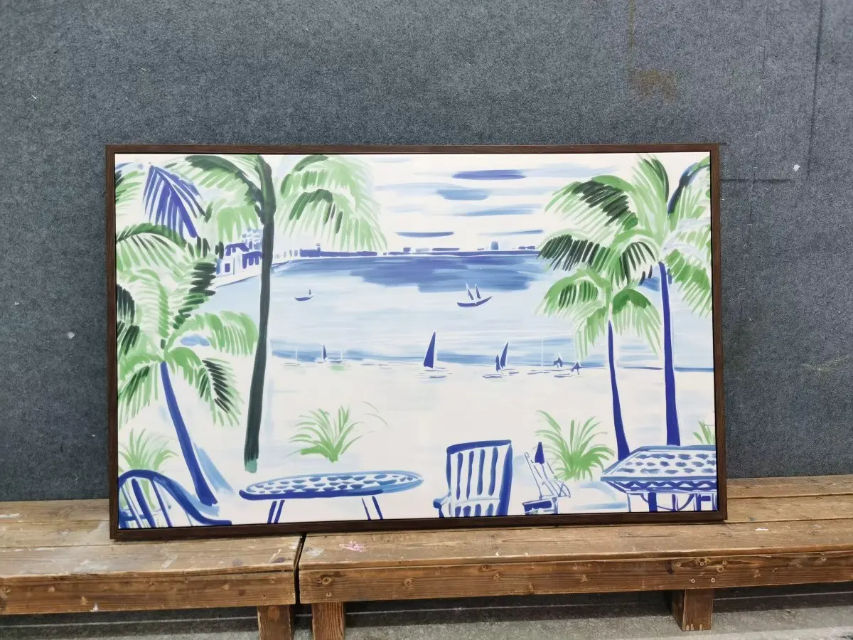 Framed coastal artwork with palm trees and ocean scene, GZS sourced for hospitality interiors.