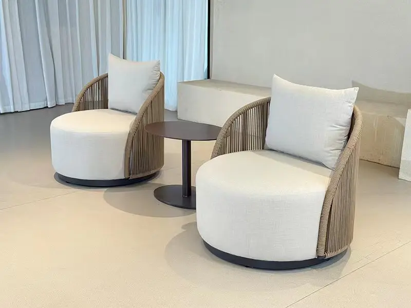 Sapphire Sands Villas lounge chairs with curved upholstered seating and woven wood frame, sourced by Guangzhou Sourcing