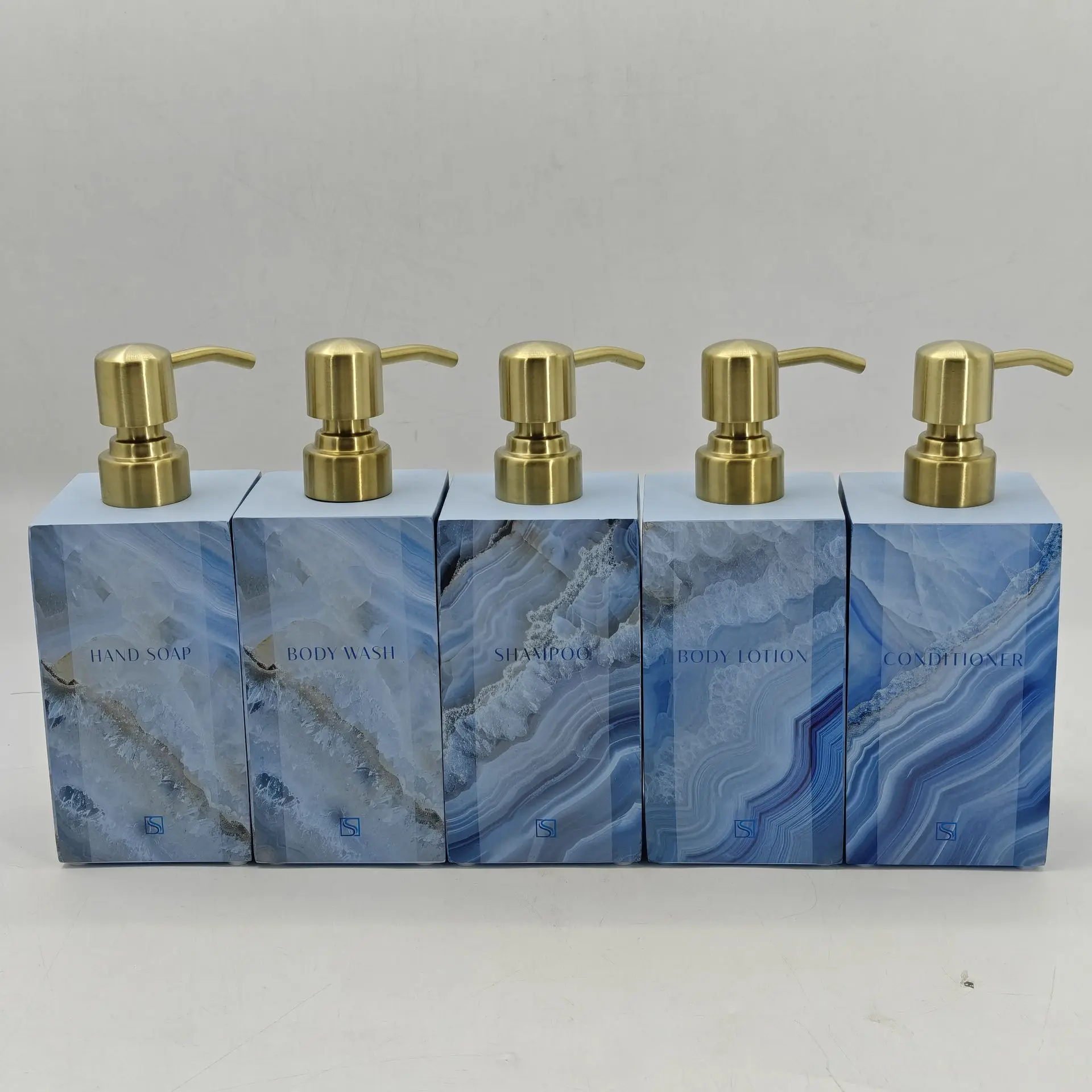 Sapphire Sands Villas soap and lotion dispensers featuring blue marble design and brass pumps