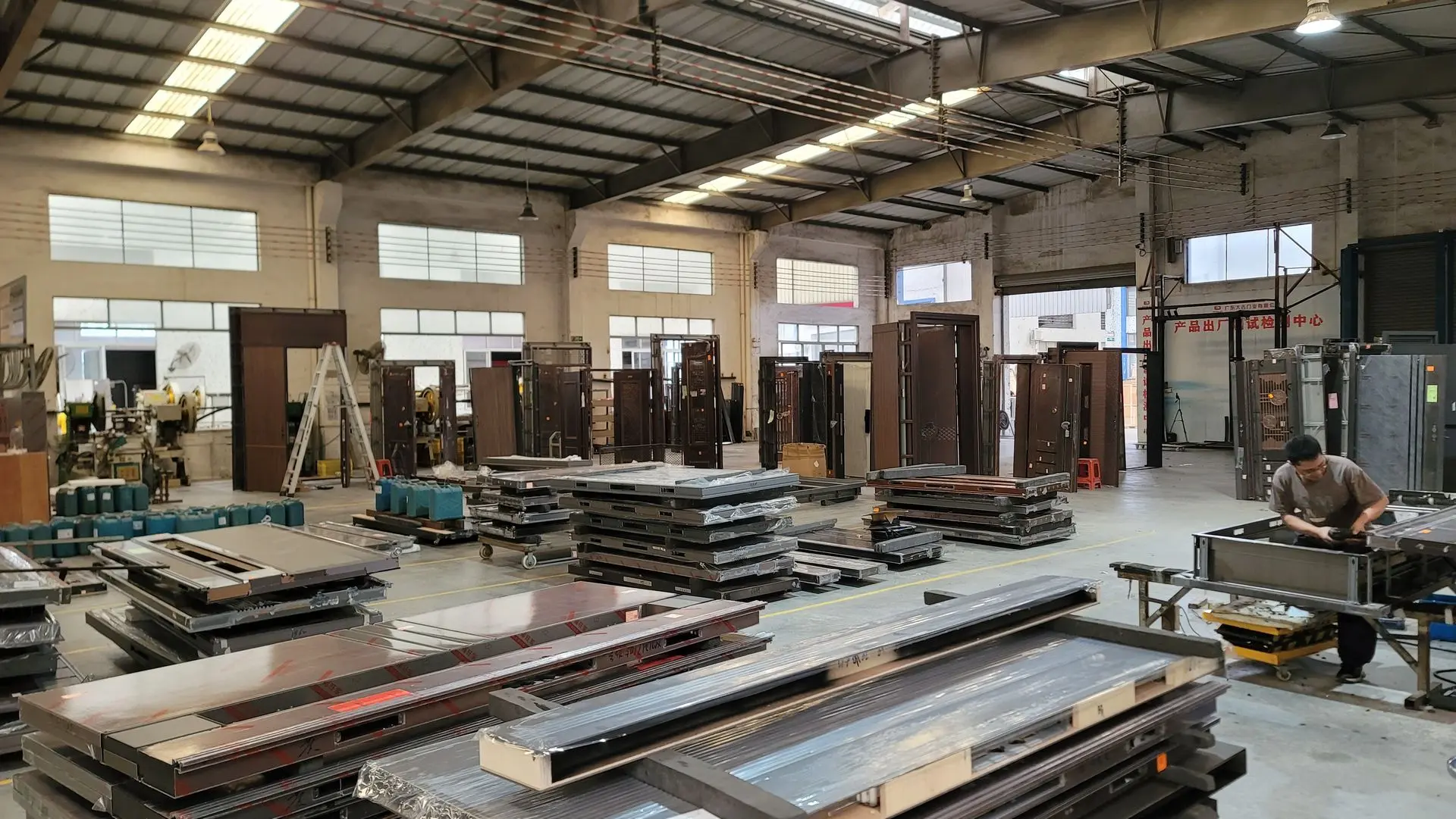 China window and door factory interior showing production line and materials