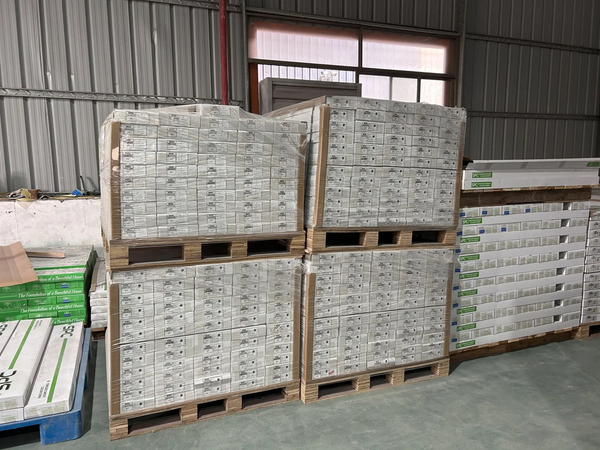 Palletized construction materials prepared for export during China material sourcing logistics