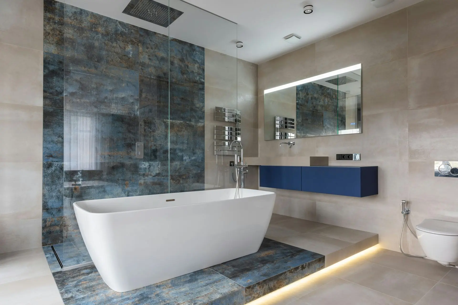 Modern bathroom sanitary ware shipping example featuring freestanding bathtub, wall-mounted vanity, glass shower enclosure, and ceramic fixtures
