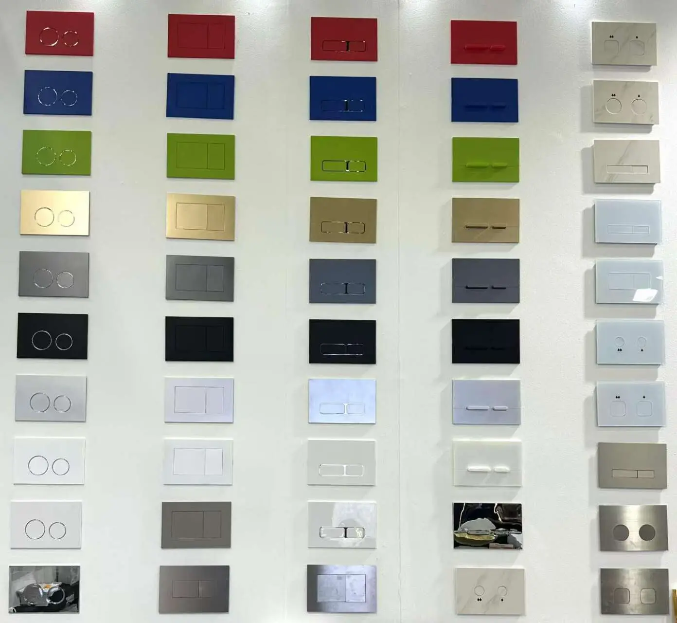 Dual flush plates for water-efficient LEED sanitary ware systems in modern bathrooms