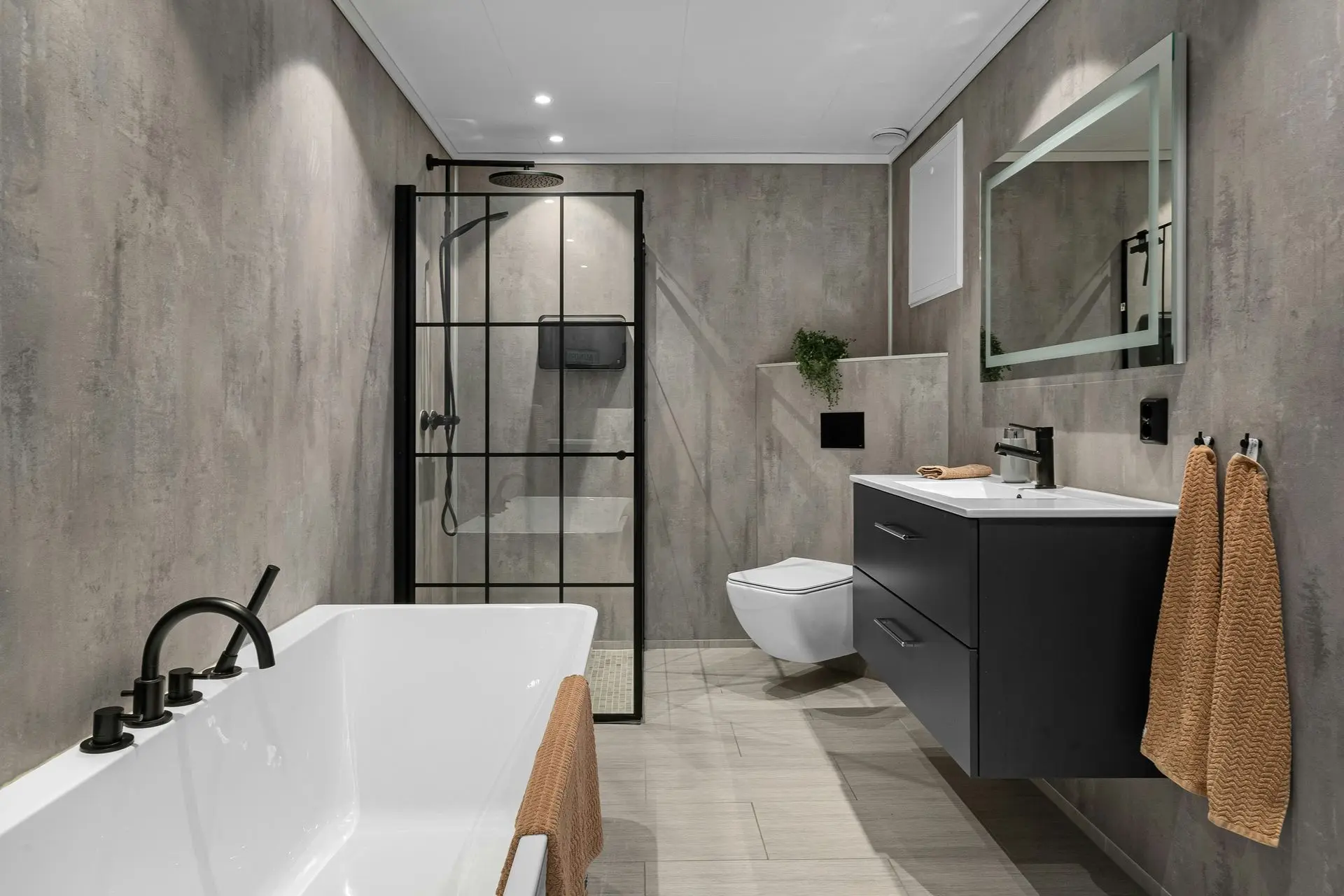 Modern bathroom with smart sanitary ware including shower, bathtub, and LEED water-efficient fixtures