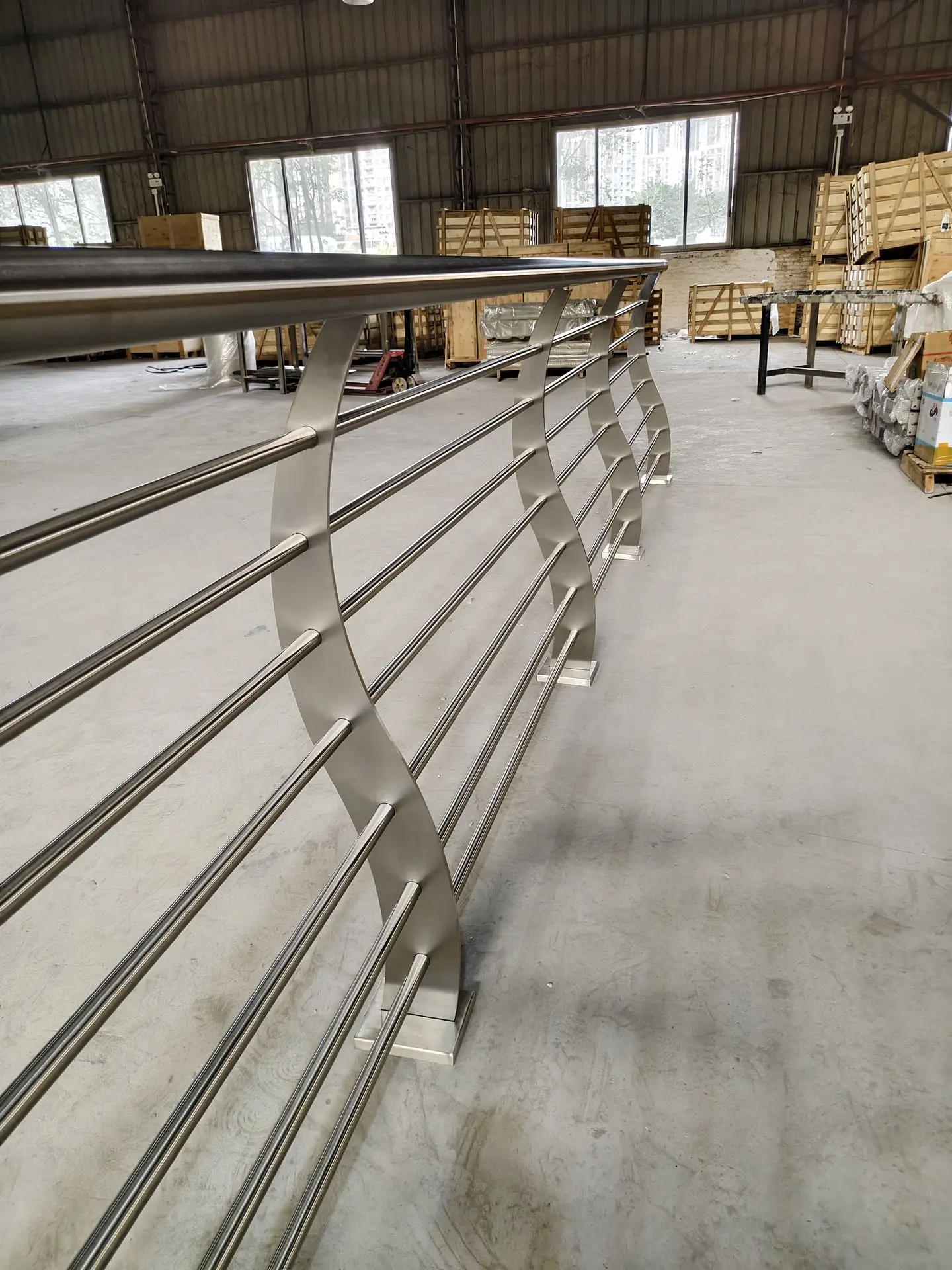 Stainless steel horizontal bar railing system in factory showcasing high-quality railings in China manufacturing process