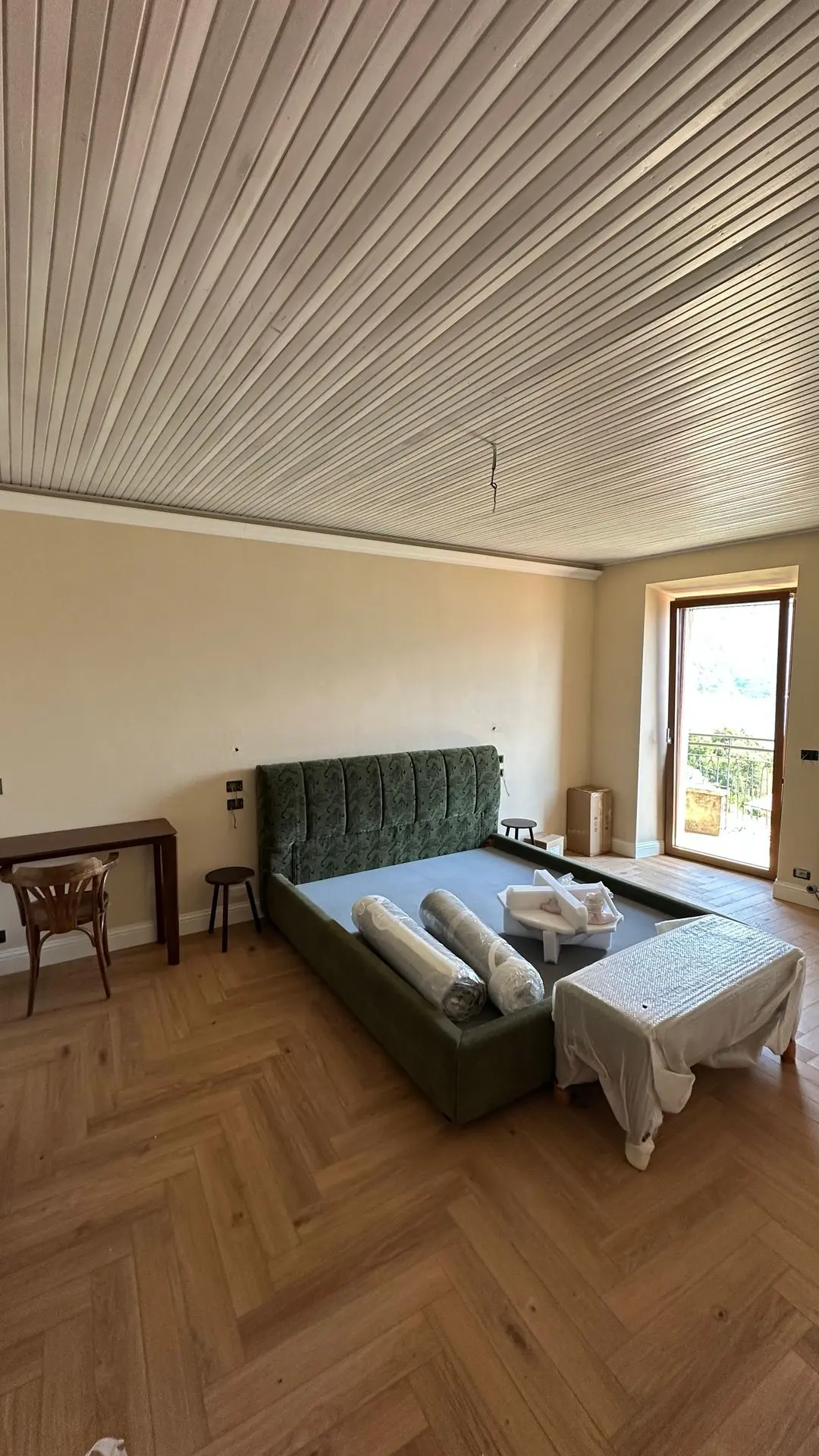 Lake Como hotel suite with seating and wood ceiling