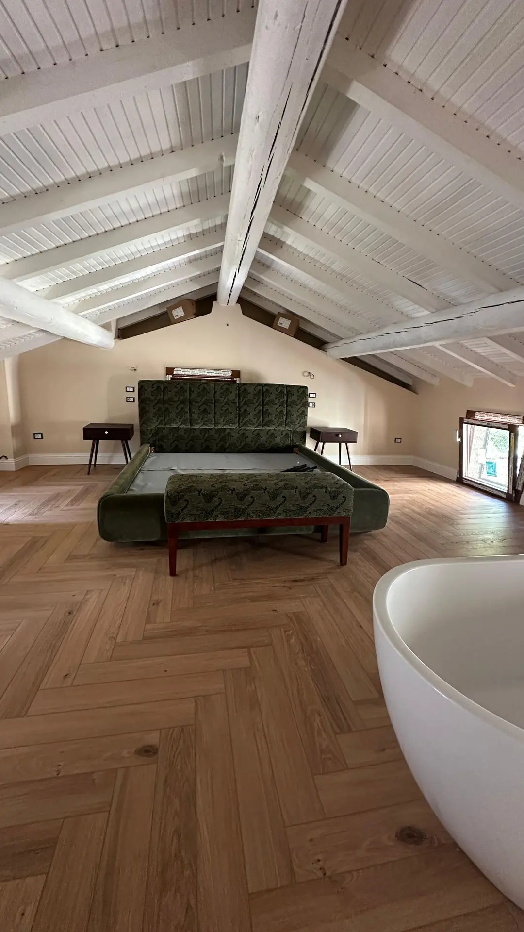 Lake Como attic bedroom with exposed beams
