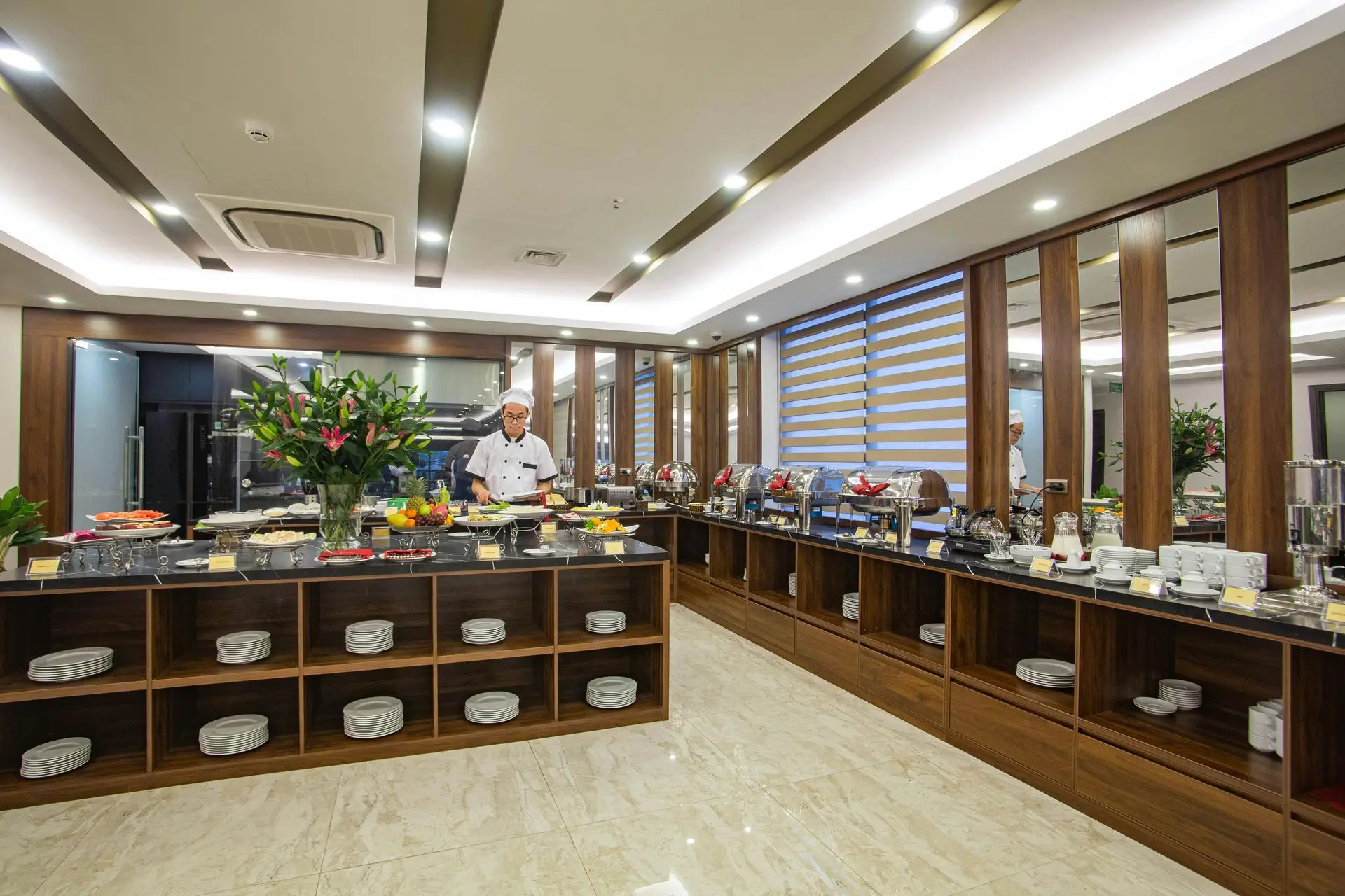 China buffet furniture with buffet counters, display shelving, and chafing dish setup in hotel China buffet furniture with buffet counters, display shelving, and chafing dish setup in hotel