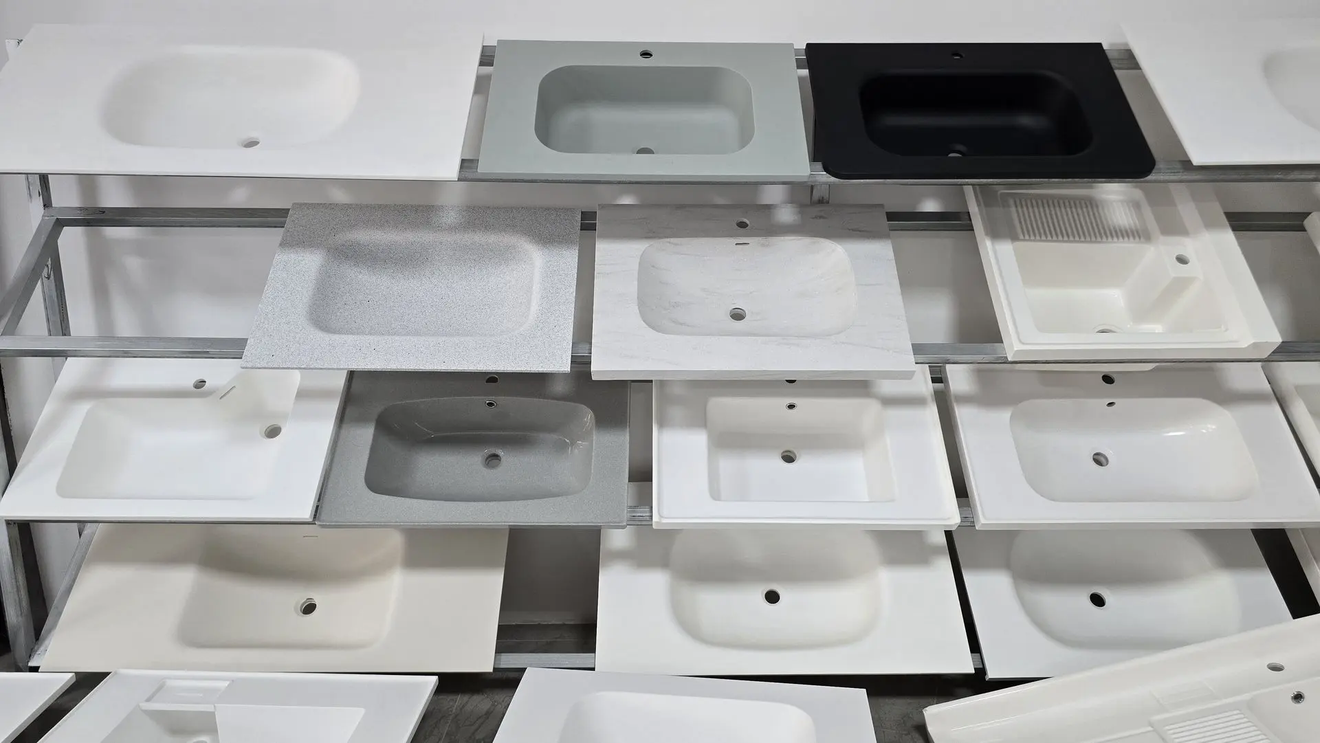 China sanitary ware location displaying modern bathroom basins in Foshan showroom