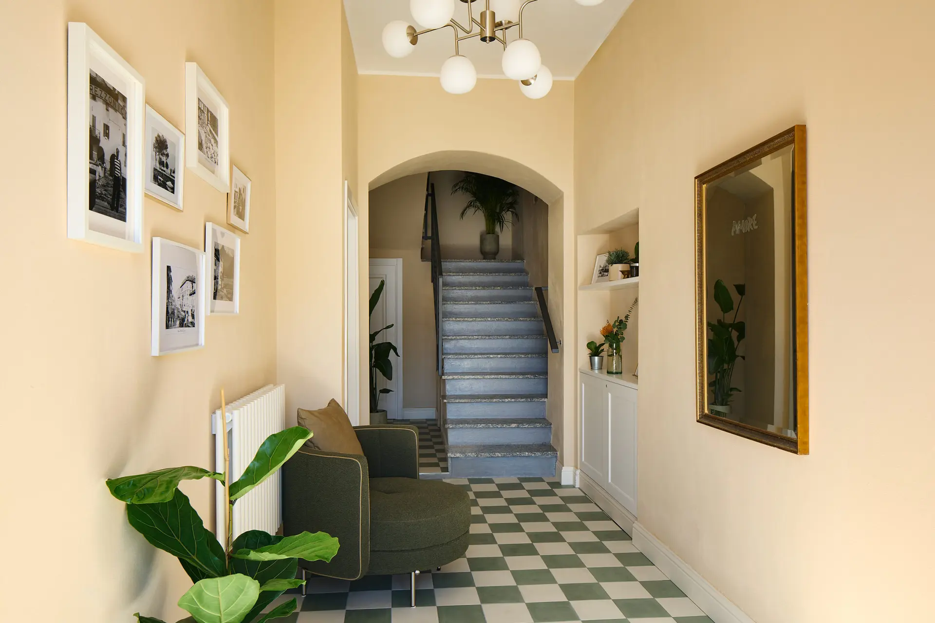 Warm and inviting corridor at Lake Como Boutique Hotel showcasing sourced FF&E furnishings, decorative wall art, and premium interior finishes