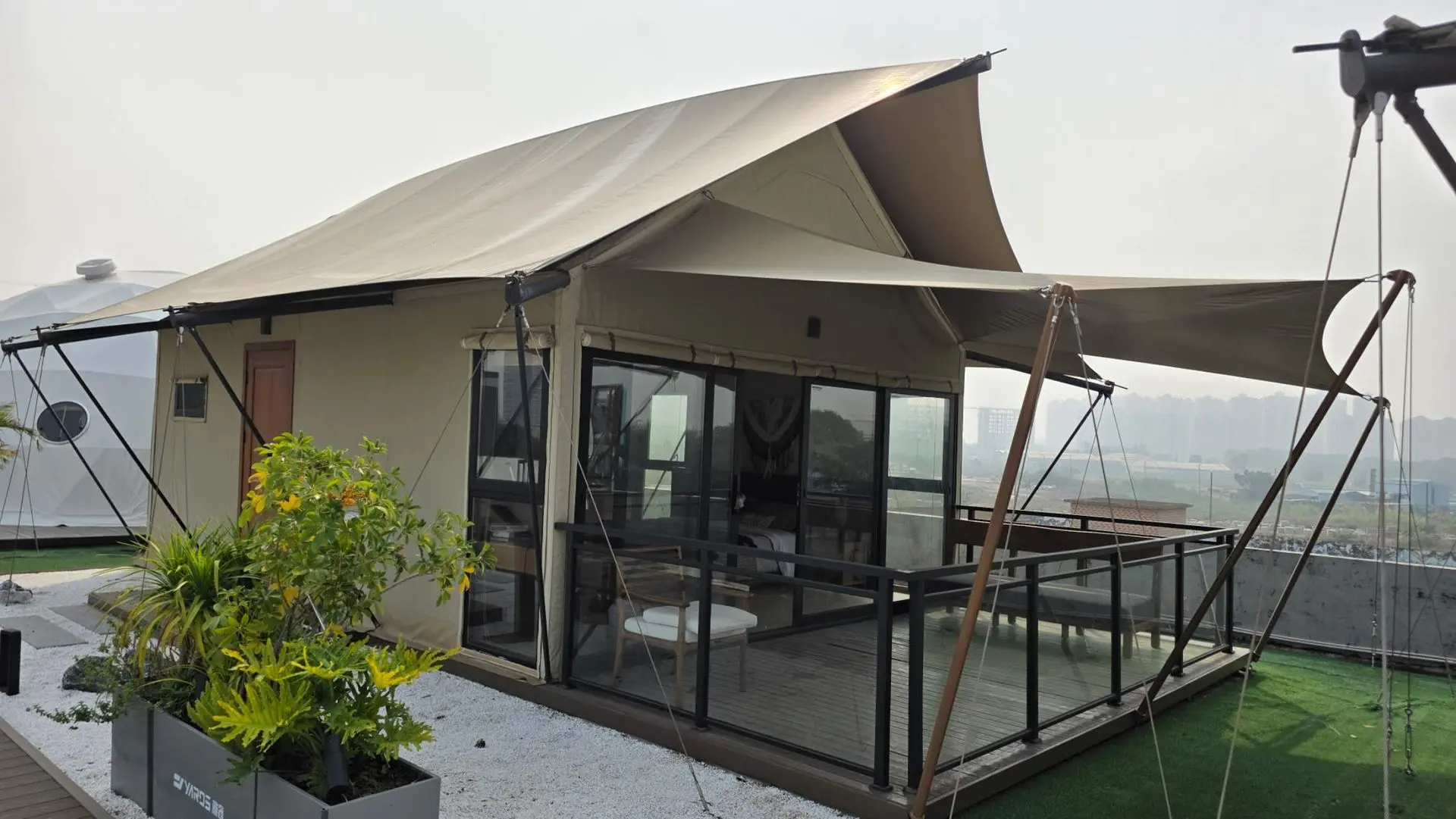 Custom China glamping tent with luxury outdoor deck and modern eco-resort accommodation design