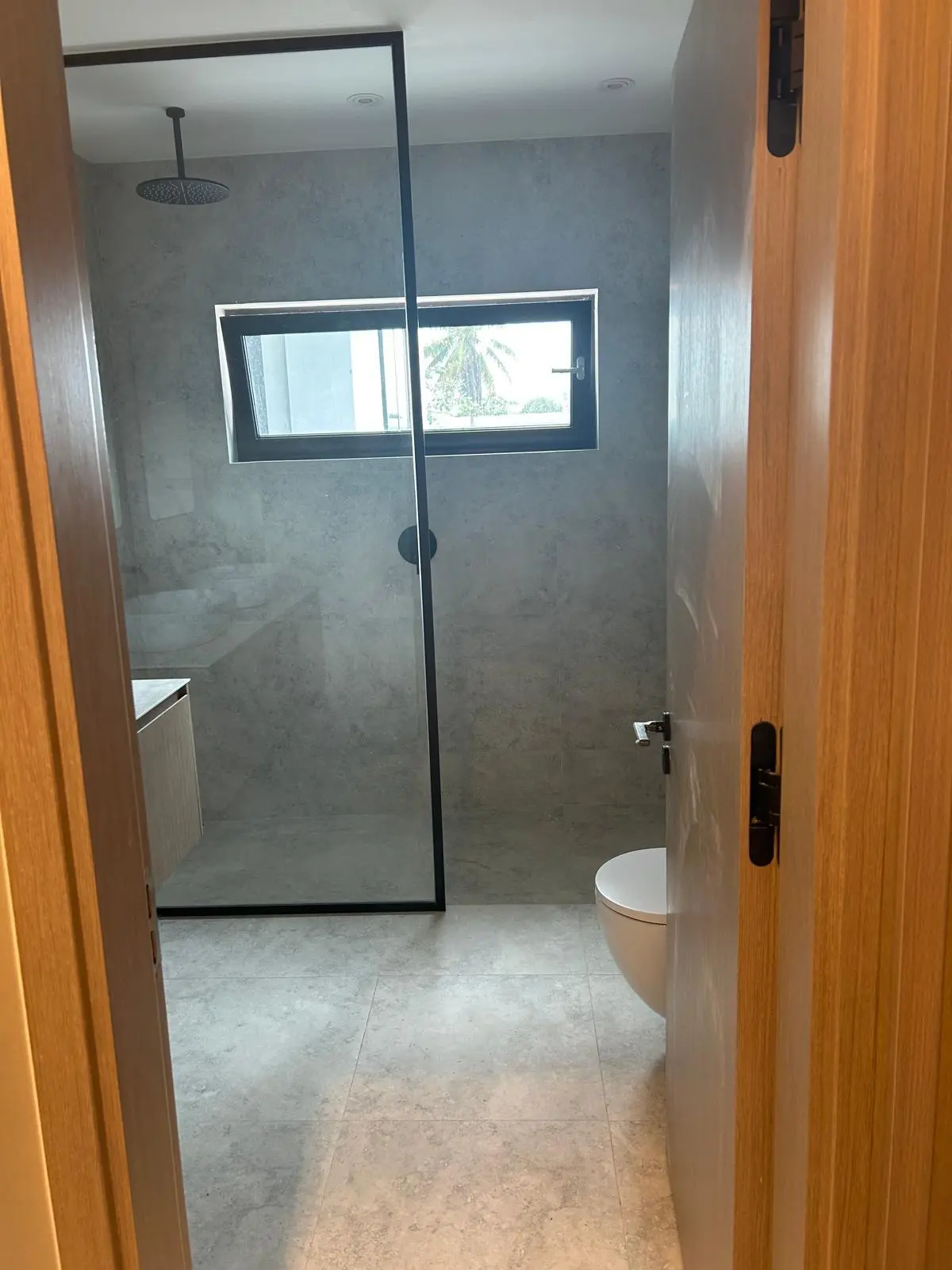 160 Atlantic bathroom featuring a glass shower partition, sanitary ware, and wall finishes sourced by Guangzhou Sourcing