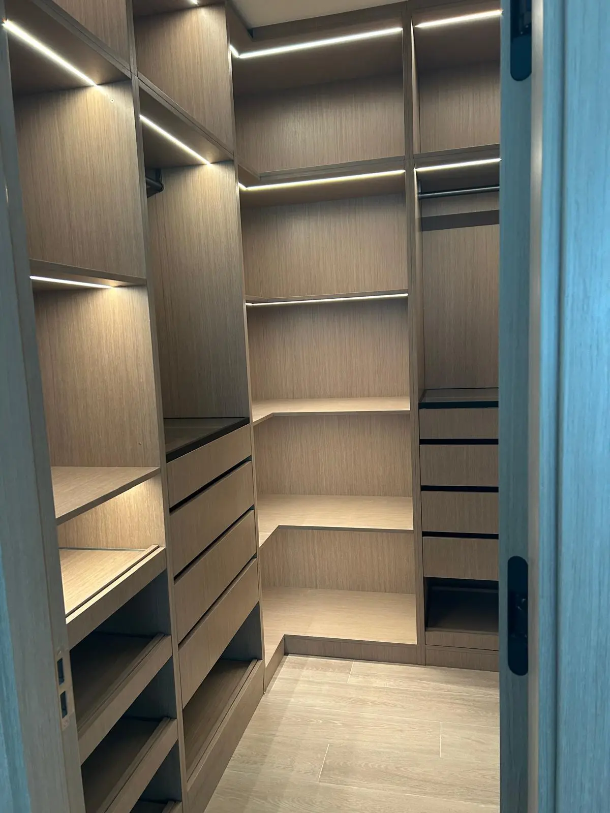 160 Atlantic walk-in closet featuring custom shelving, drawers, and illuminated storage solutions sourced by Guangzhou Sourcing