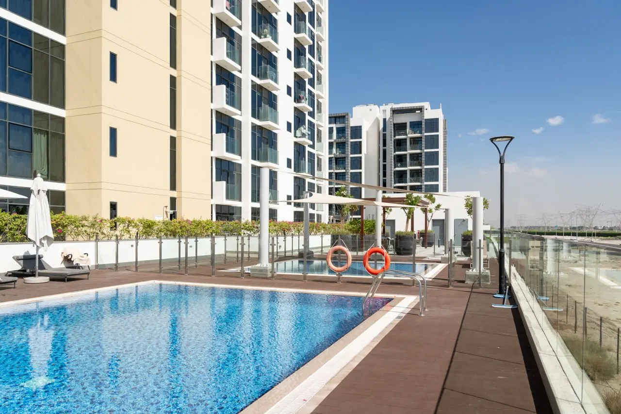 Frameless glass swimming pool fencing installed in a modern apartment development showcasing premium design and quality