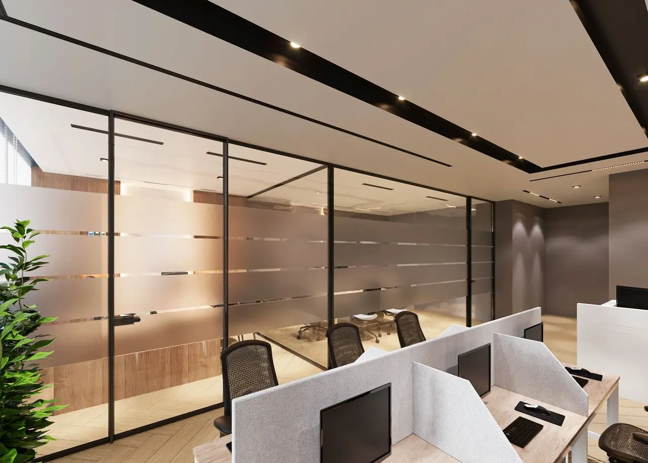 Office interior with PVB laminated glass partitions providing sound insulation, UV protection, and safety glazing.